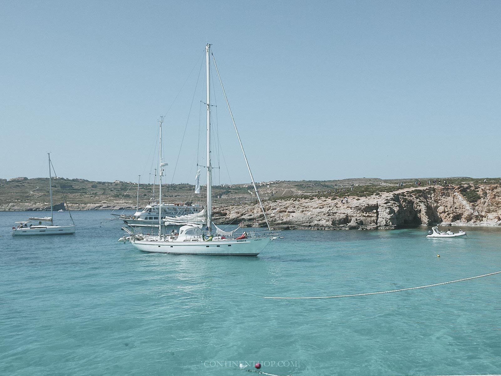 Boats docked near the comino blue lagoon malta