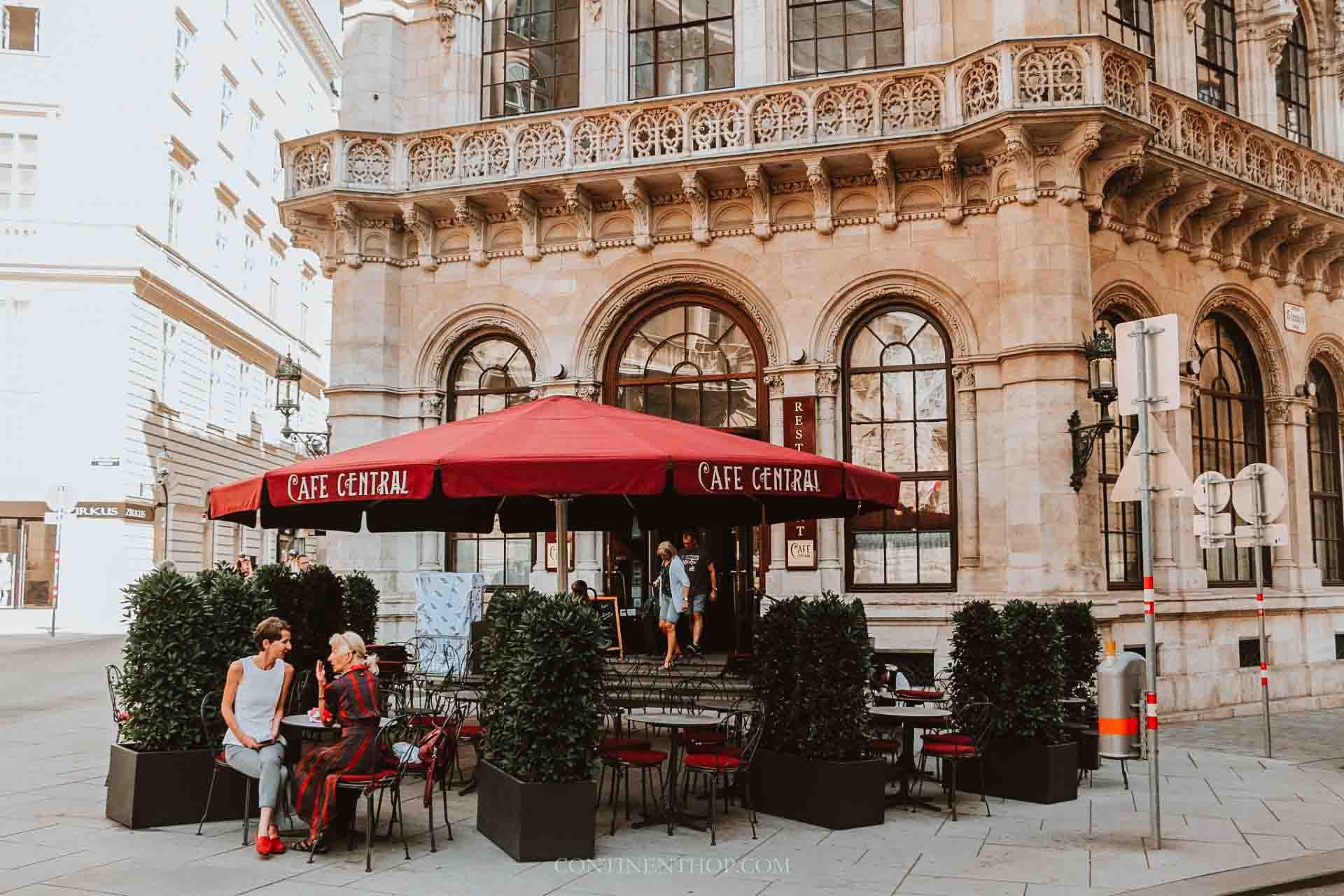 People sitting outside cafe Central in Vienna on a 3 month itinerary Europe