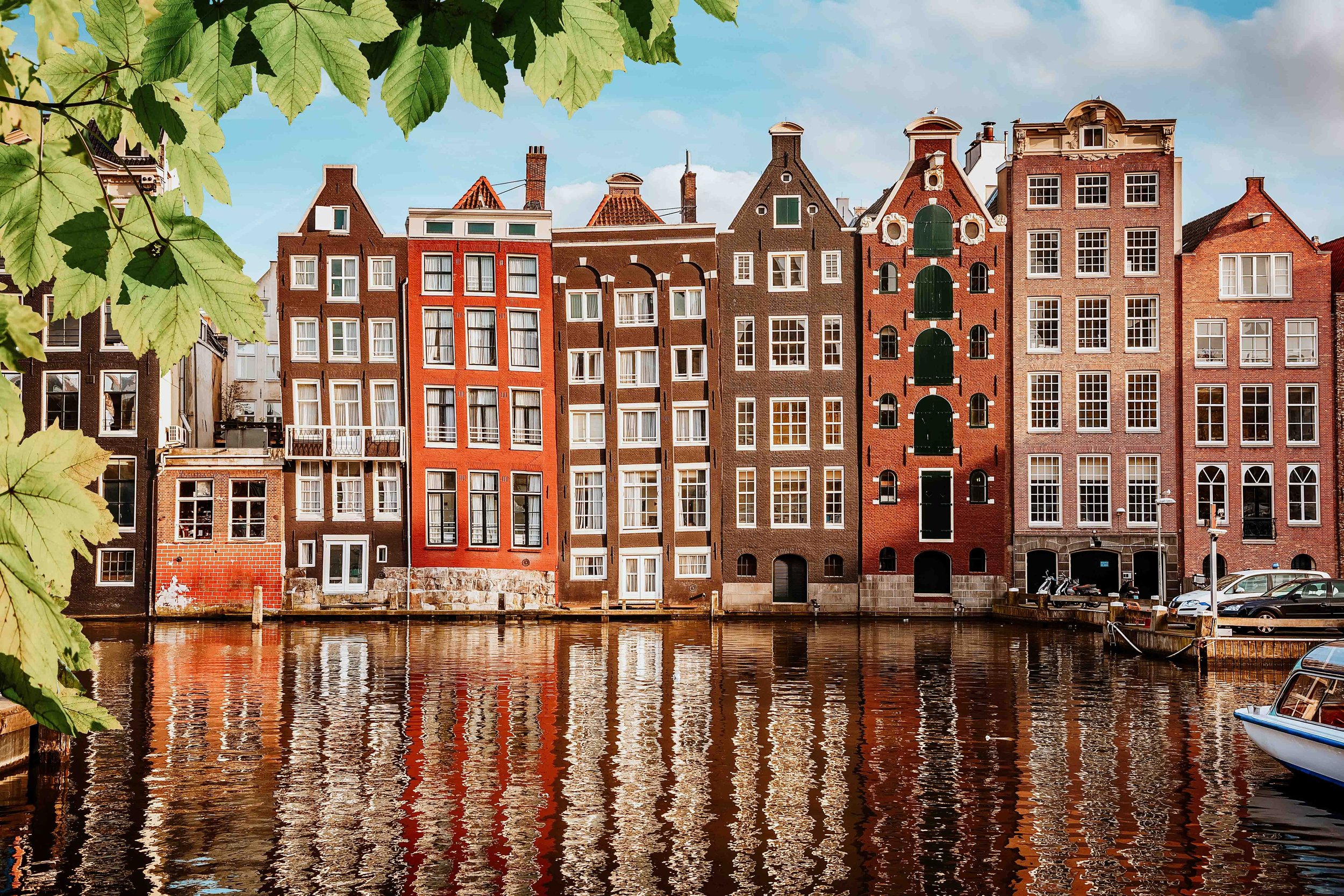 Colourful houses by the canals in Amsterdam on a 3 month Europe trip itinerary