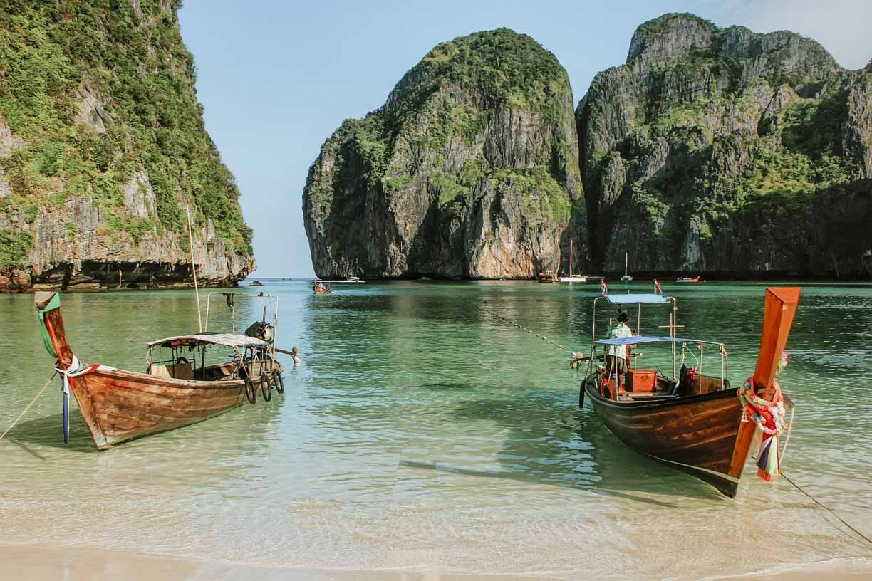 Two boats harbored on the beach in Phuket - Things to do on your 7 days in thailand itinerary