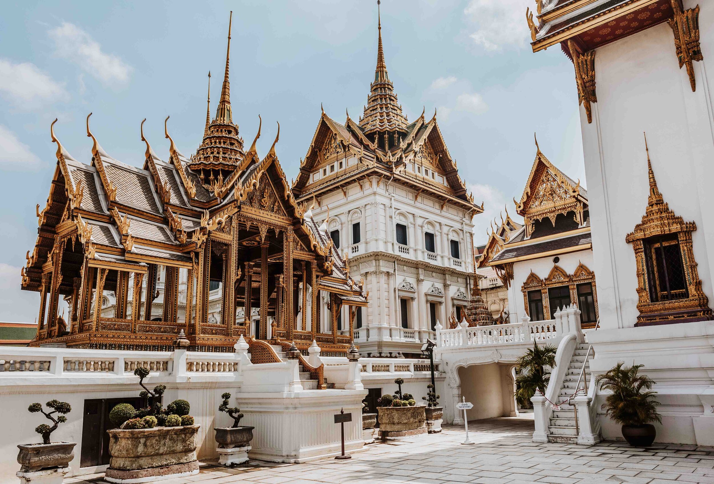 The beautiful white and gold temple of Wat Pho - Things to do on your 7 days in thailand itinerary