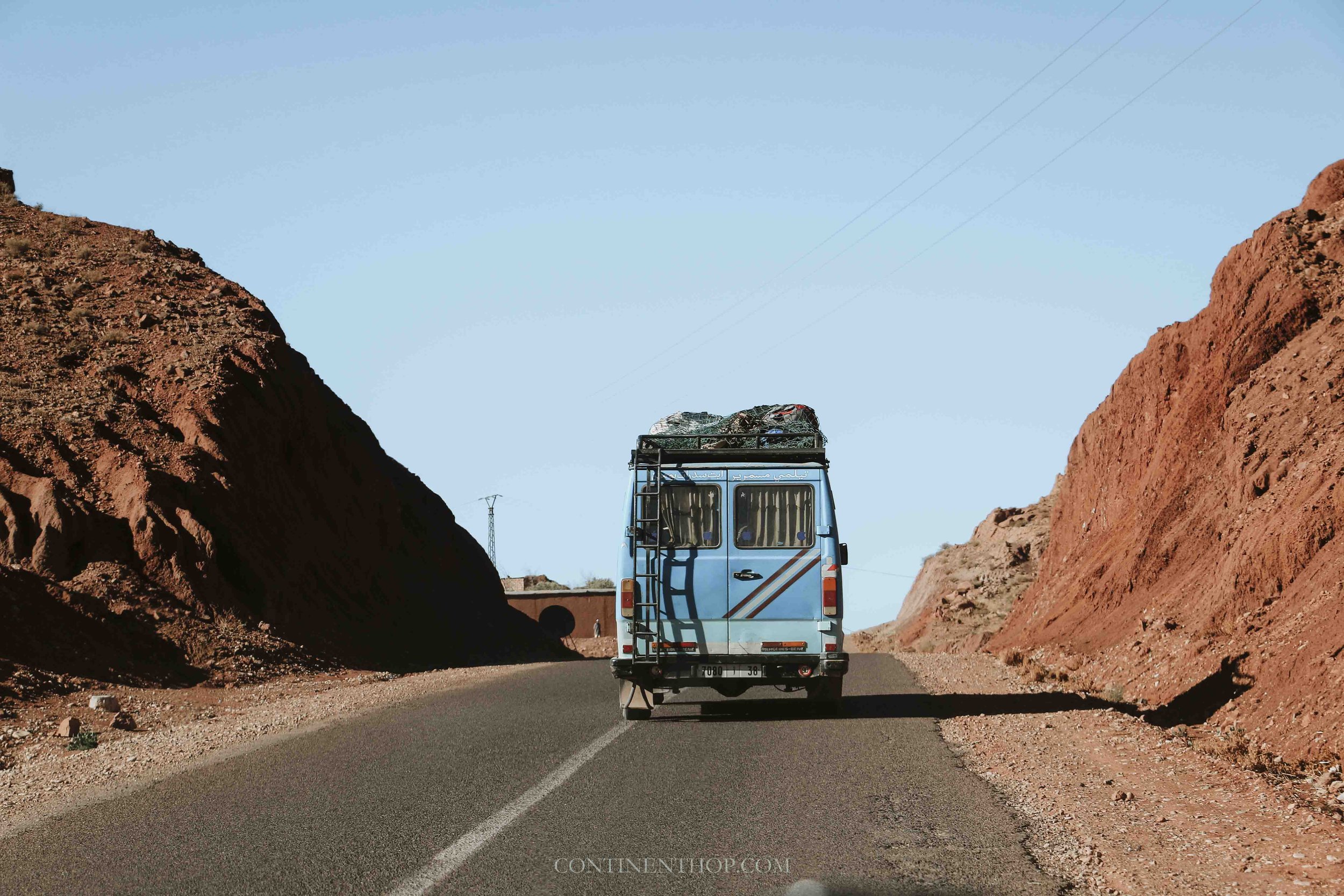 blue van on road on morocco 7 day itinerary