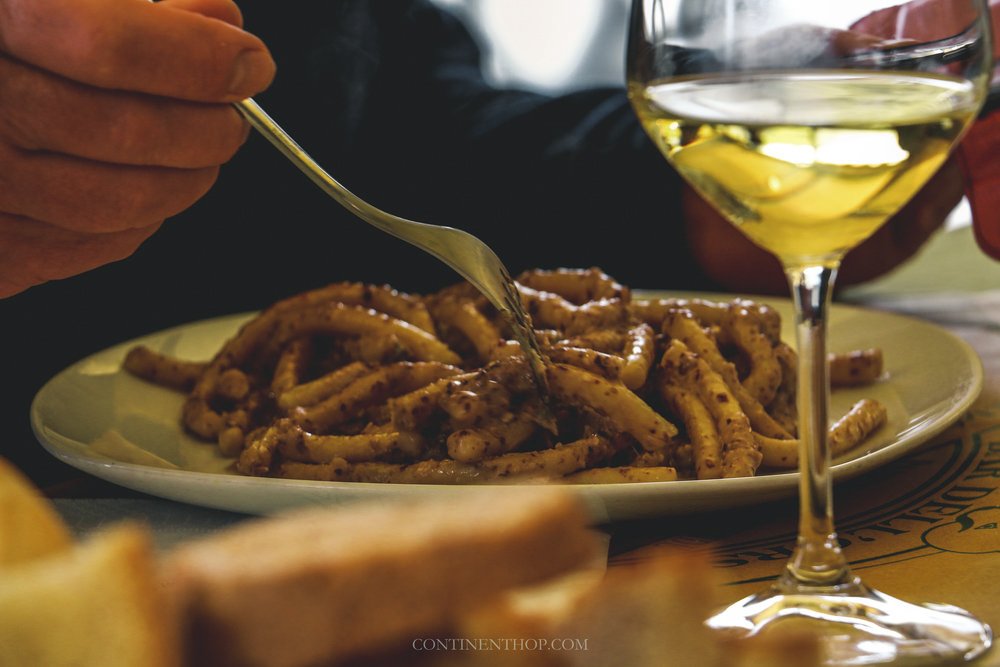 summer holidays in Italy pici pasta with wine