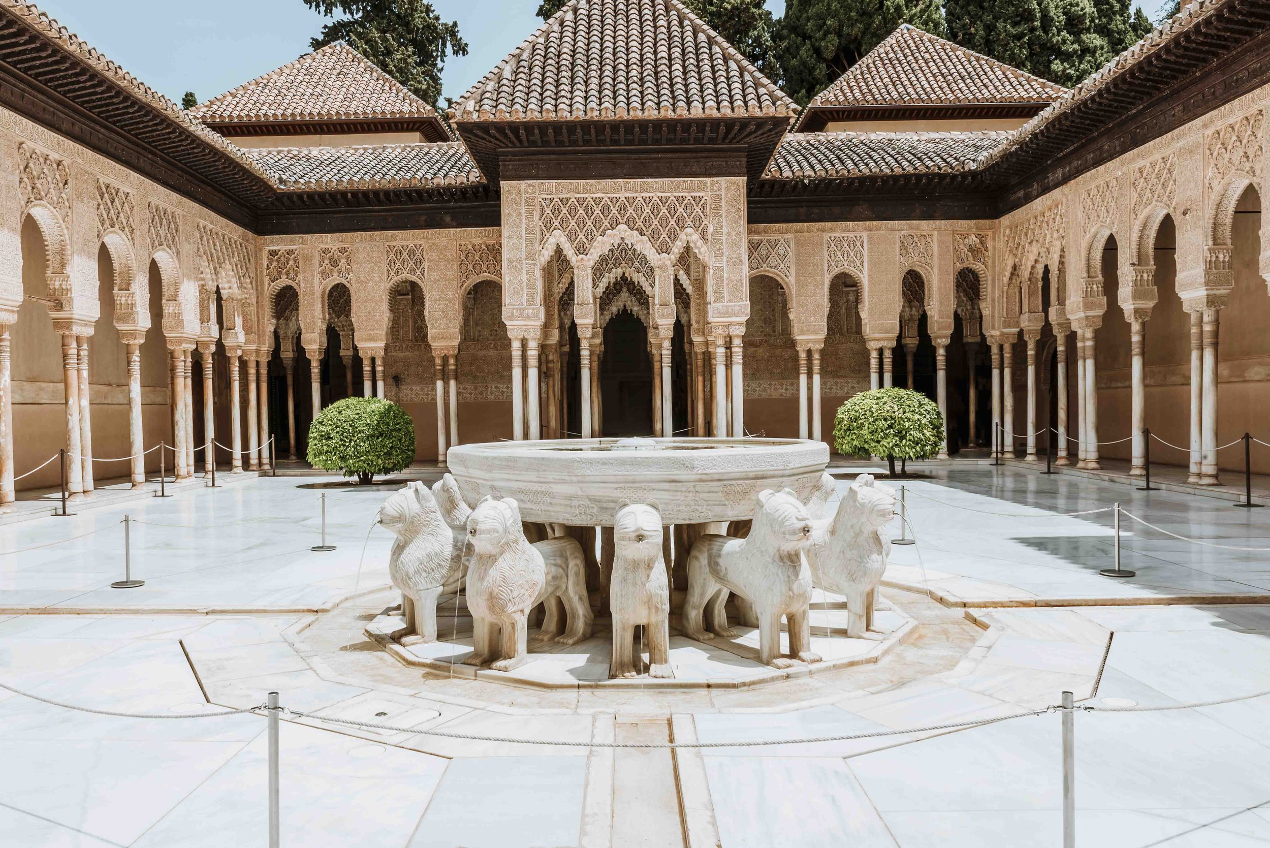 Lions supporting a water basin inside the Alhambra night