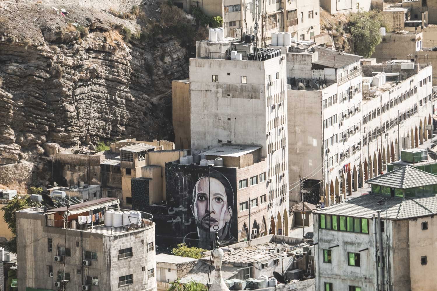 Panoramic view of buildings and street art from citadel in amman - things to do in Amman
