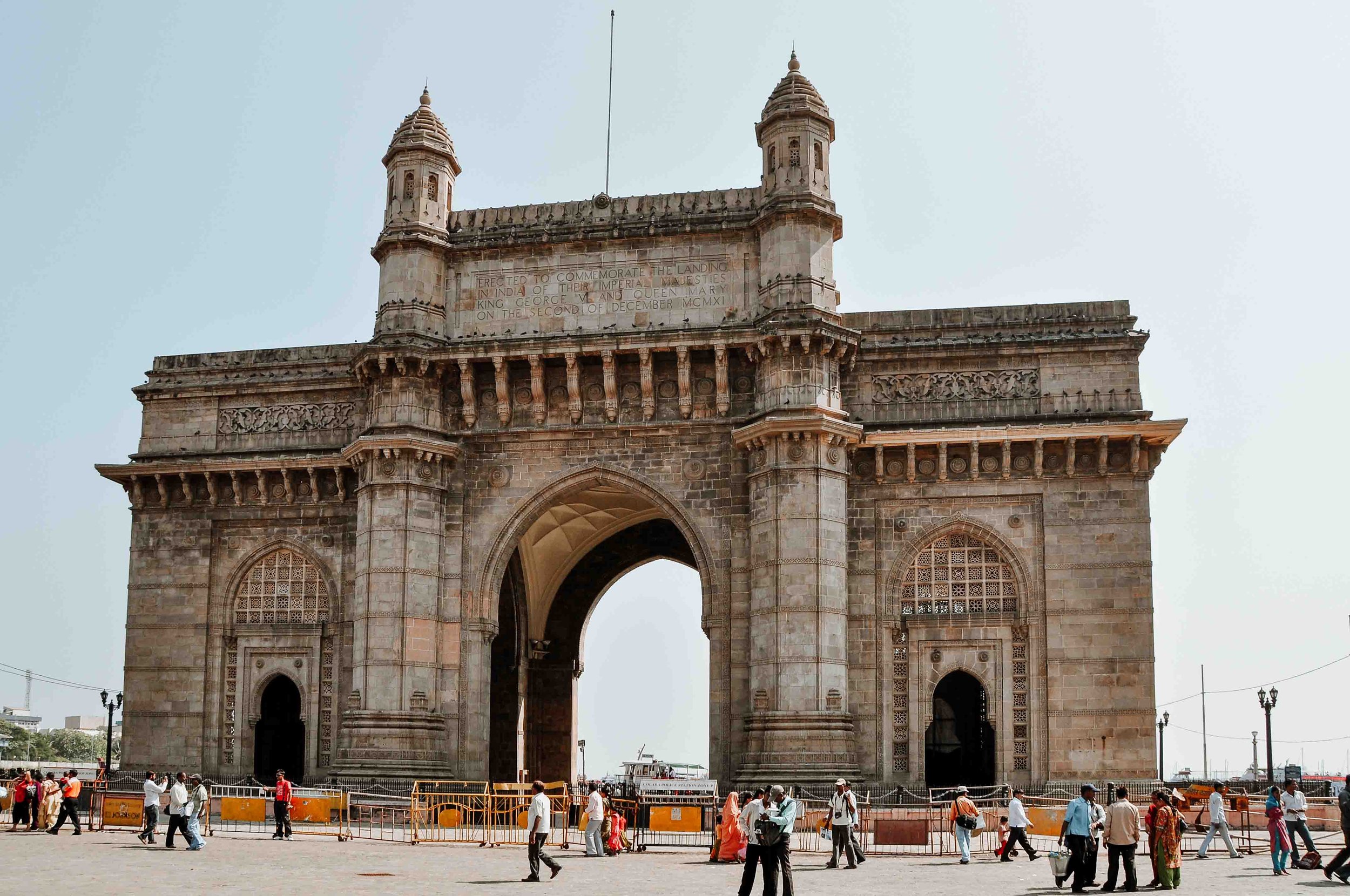 Best places to visit in India in March people walking in front of gateway of india in mumbai