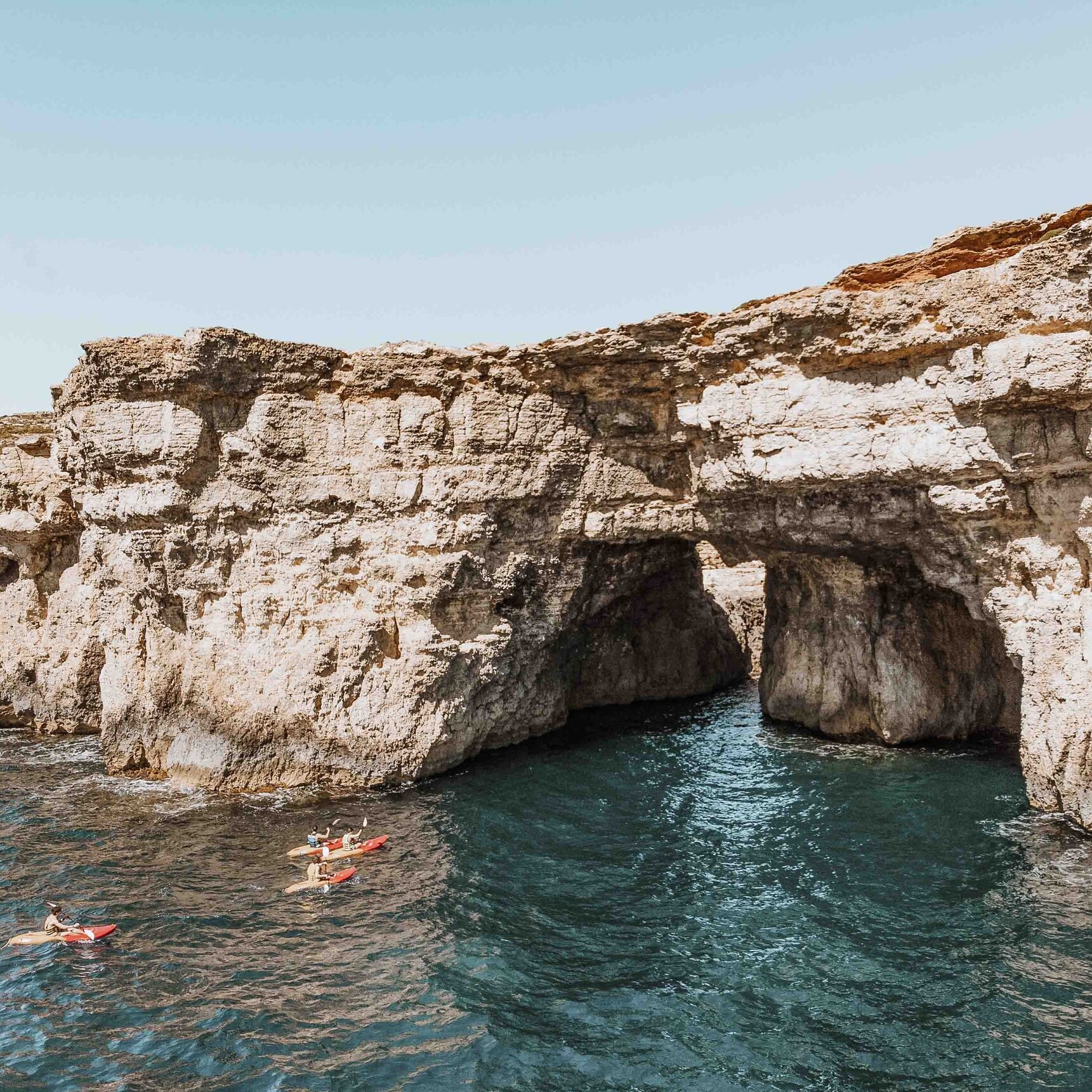 People kayaking by the Blue Lagoon Malta comino island