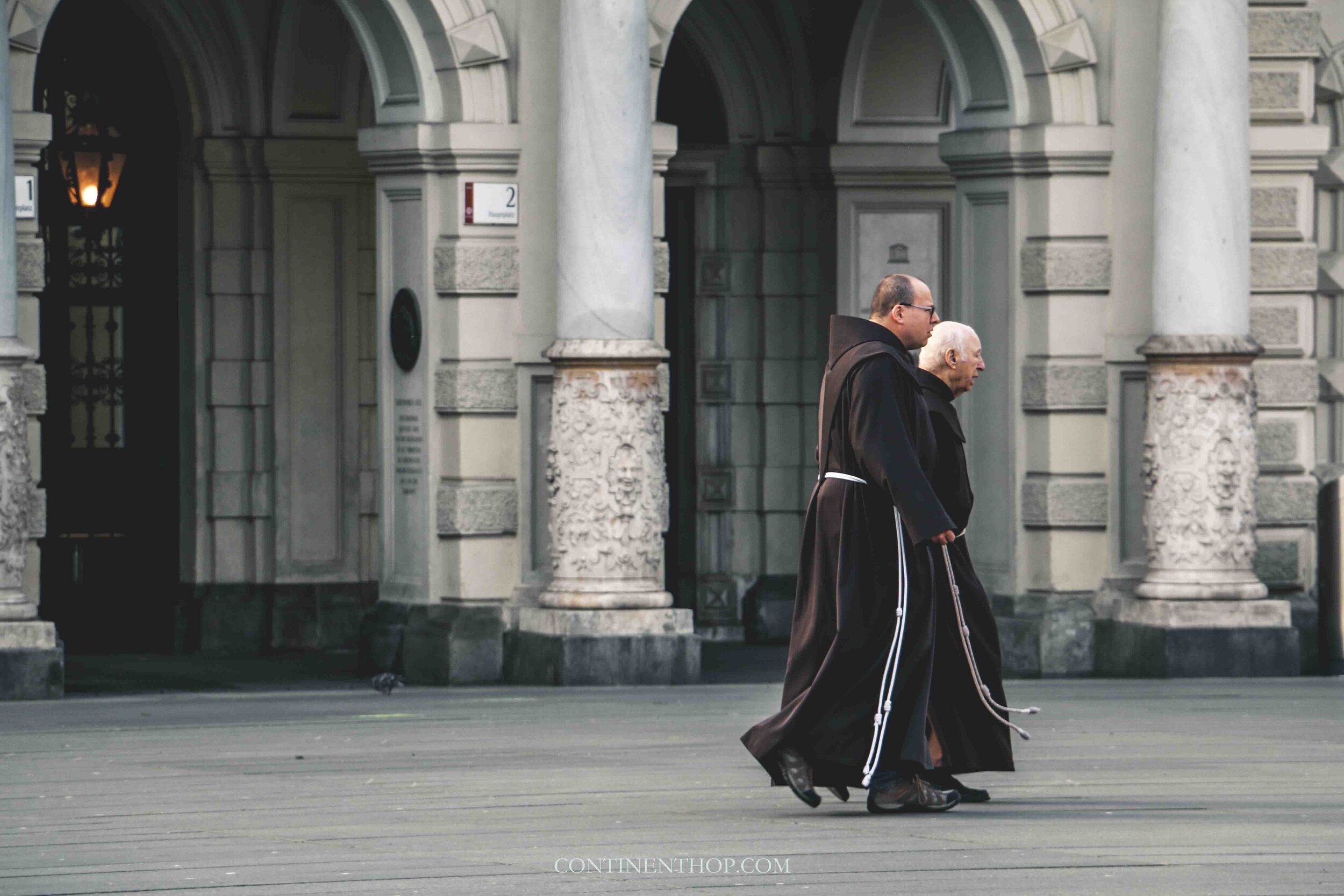 Monks walking in the city center of Graz on your Austria Itinerary 5 days