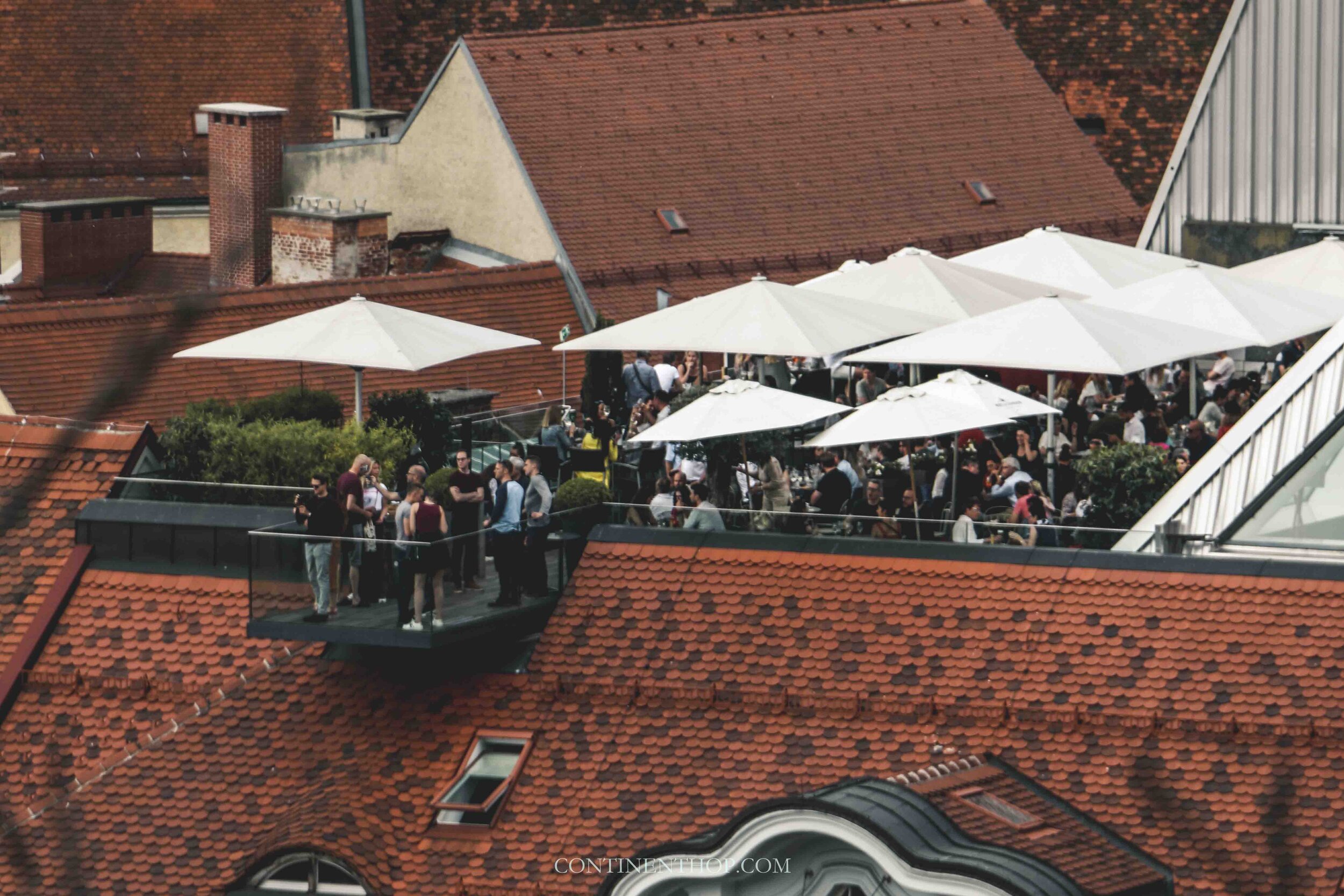 People drinking at the Tagescafe in Graz on your Austria itinerary