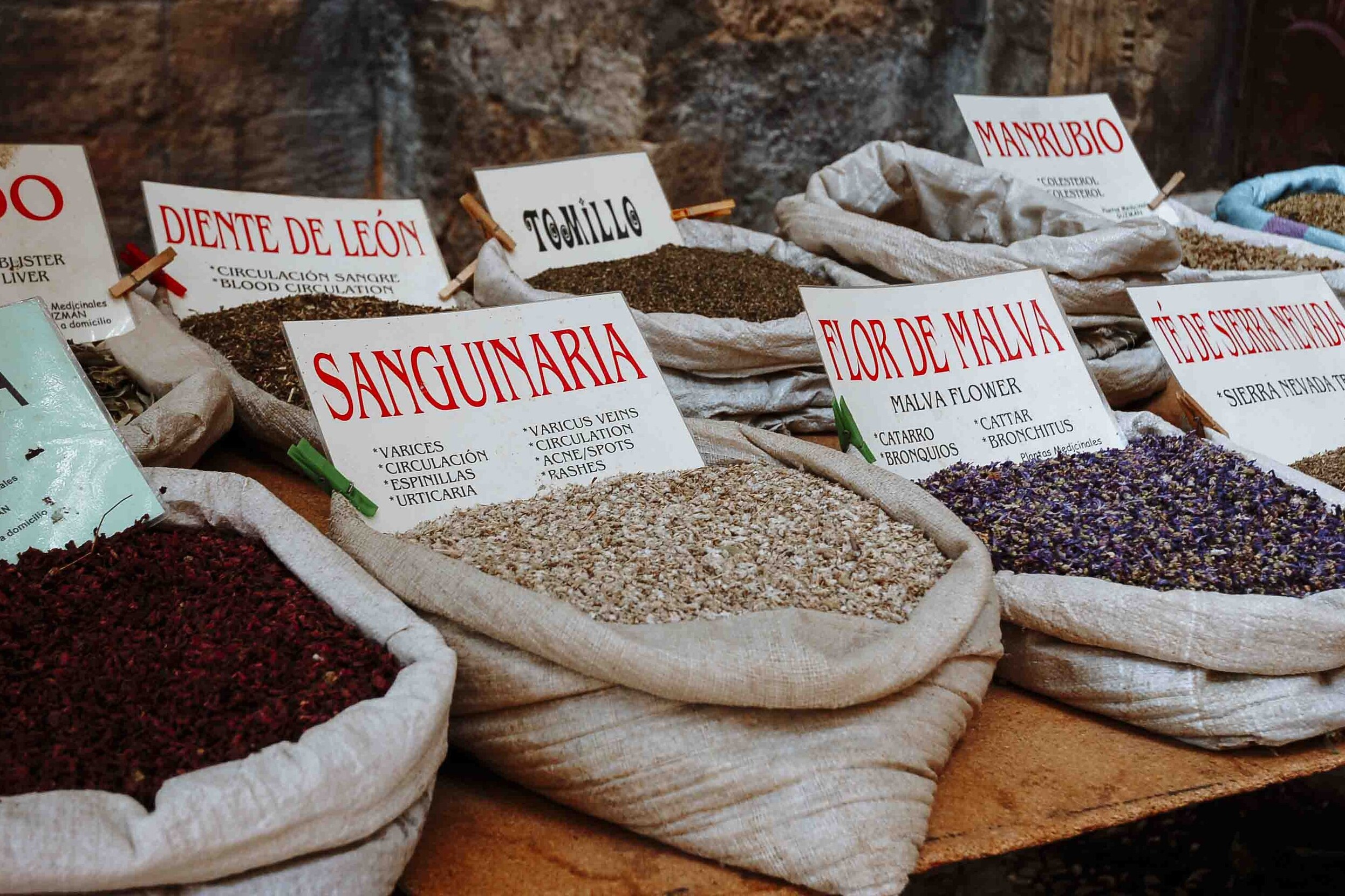 Spices on display in a granada market on day trips from seville to granada