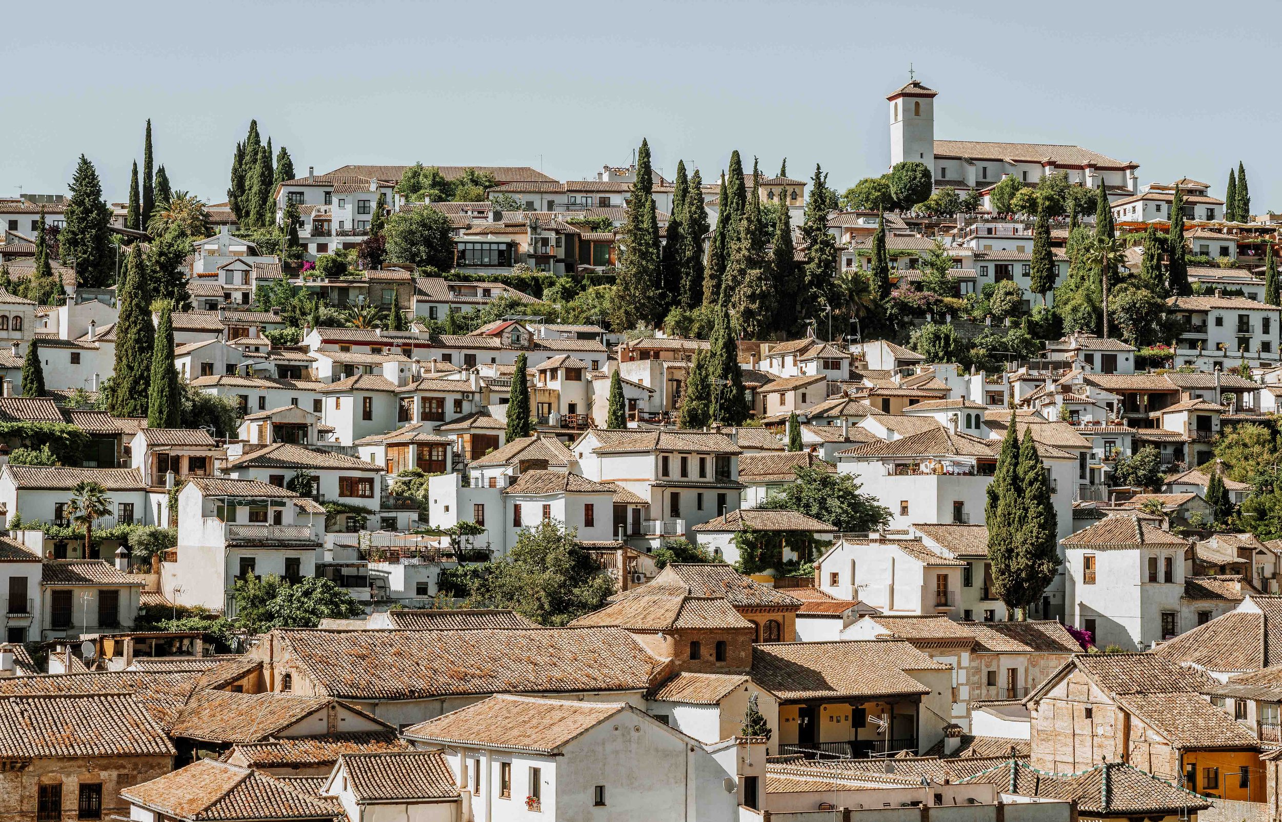 Rust colored rooftops in Granada on a seville to granada day trip