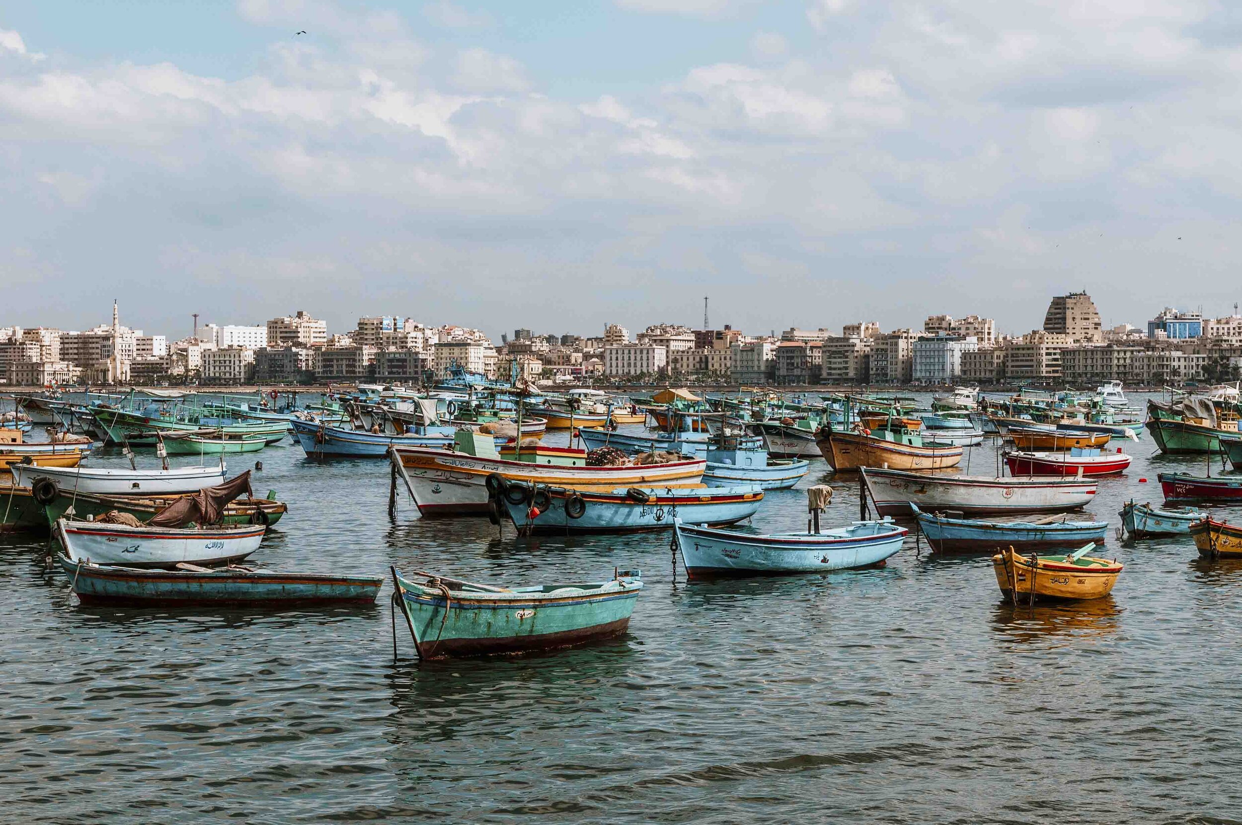 Alexandria harbour with blue boats on an itinerary for Egypt 8 days