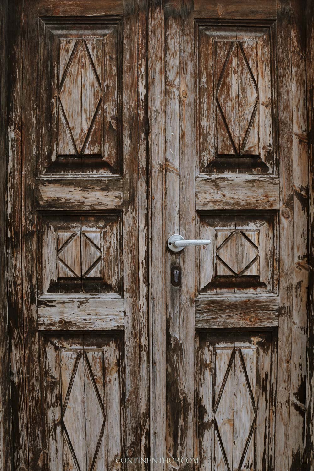 A brown door in Emporio village Santorini