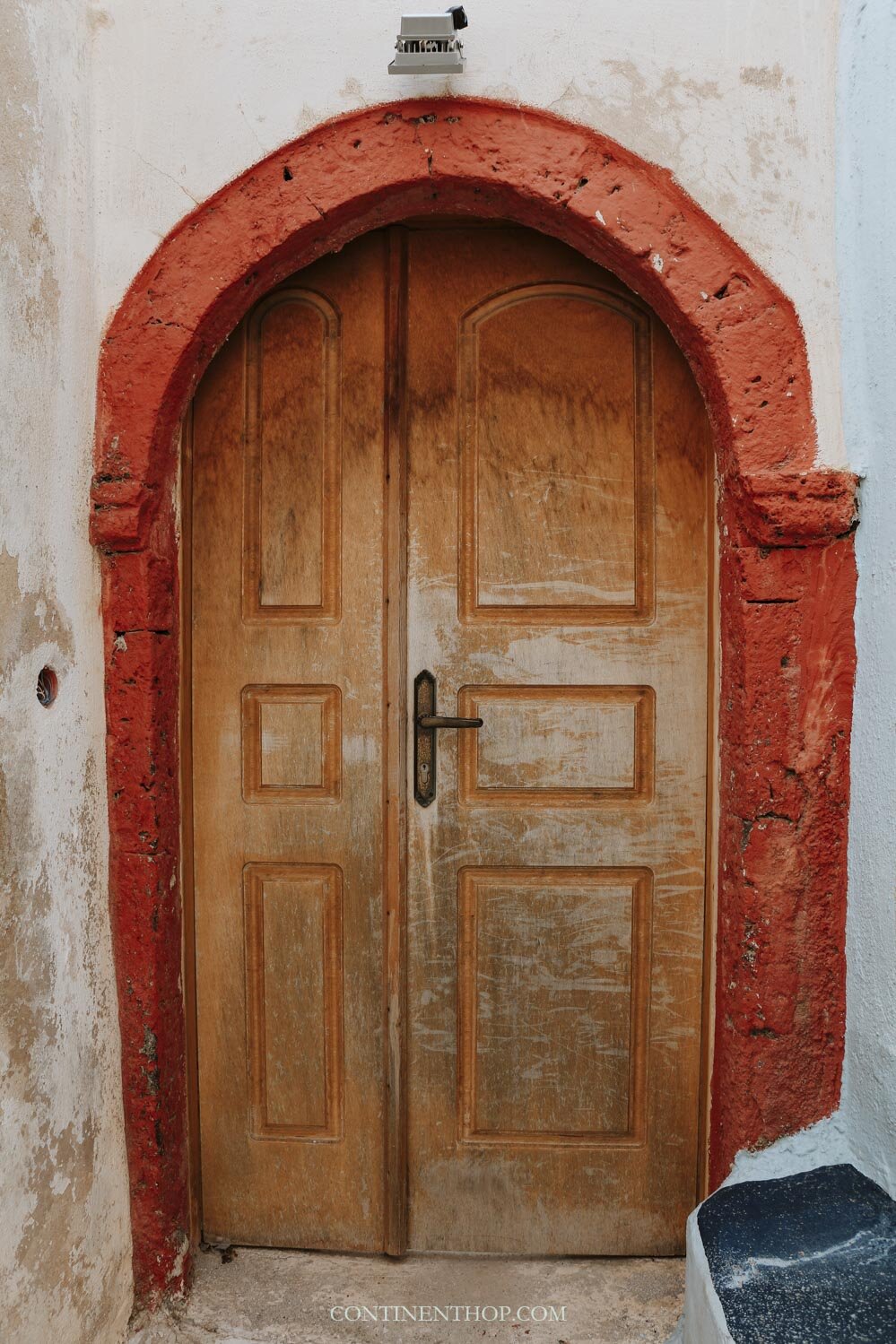 A red and yellow door in Emporio village Santorini Greece