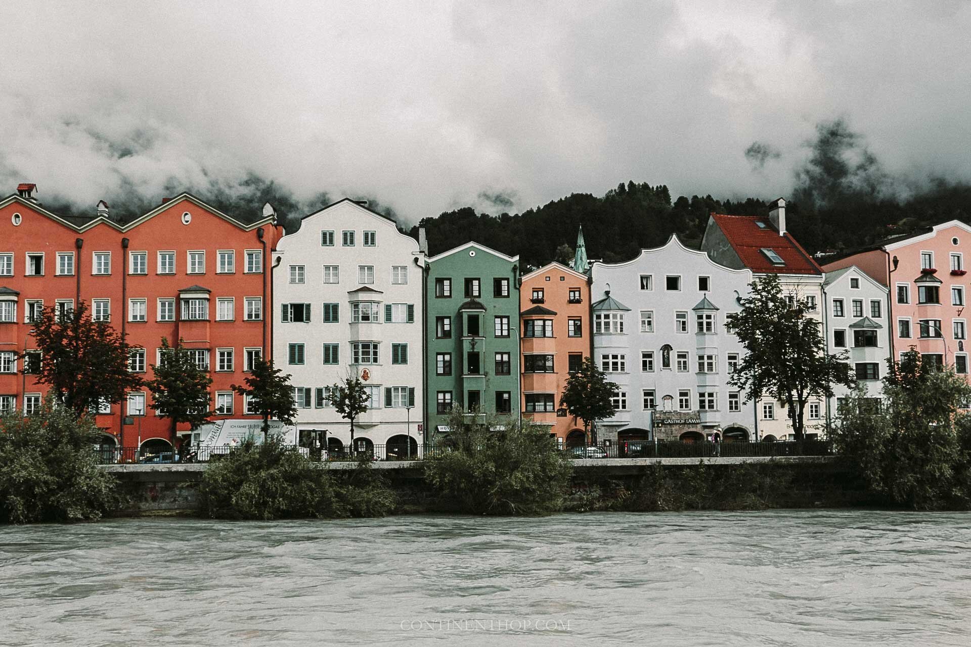 Colourful buildings by river in Innsbruck best summer european destinations