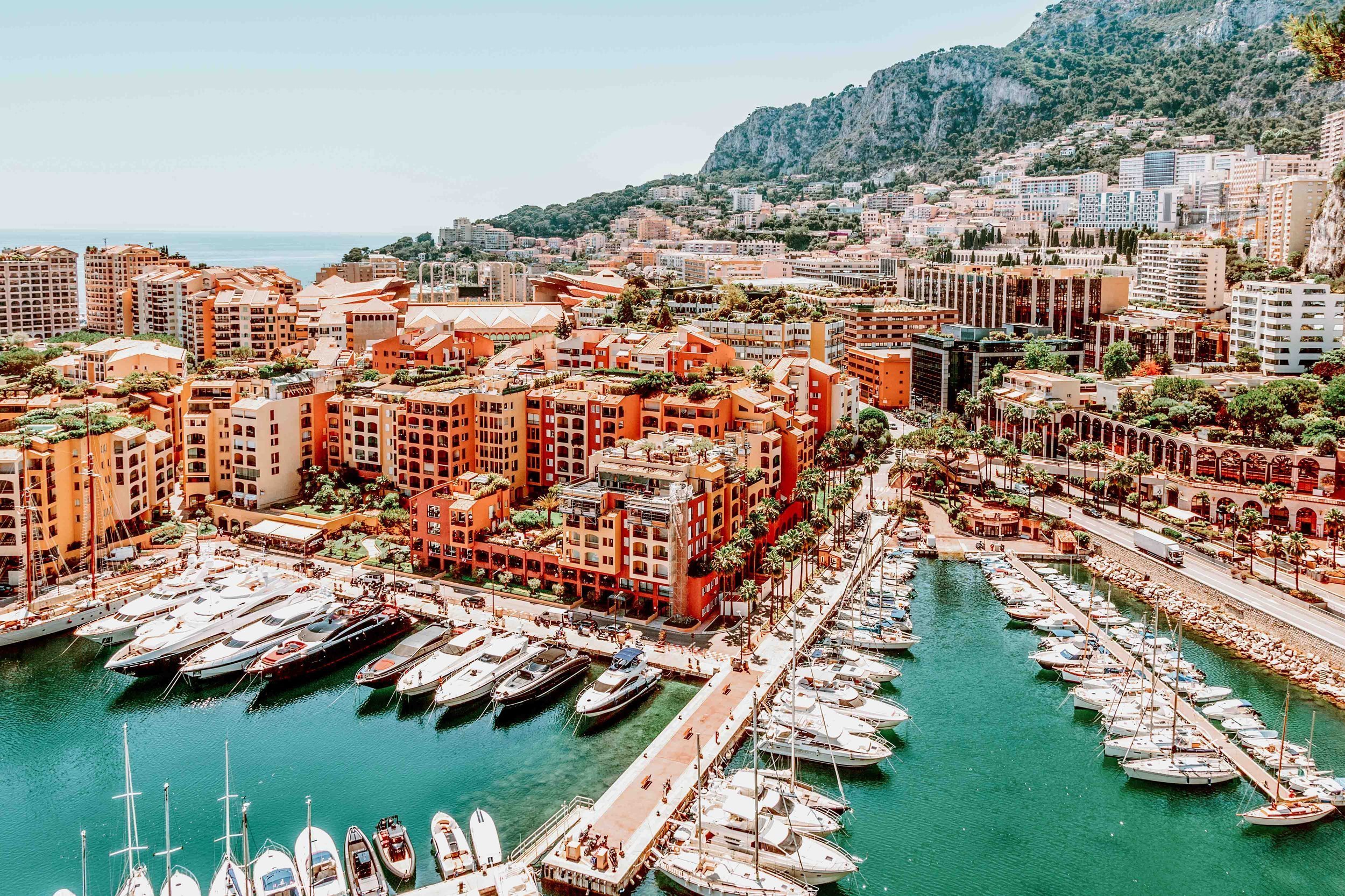 The marina with colourful yachts and colourful buildings in Monaco best summer destinations europe