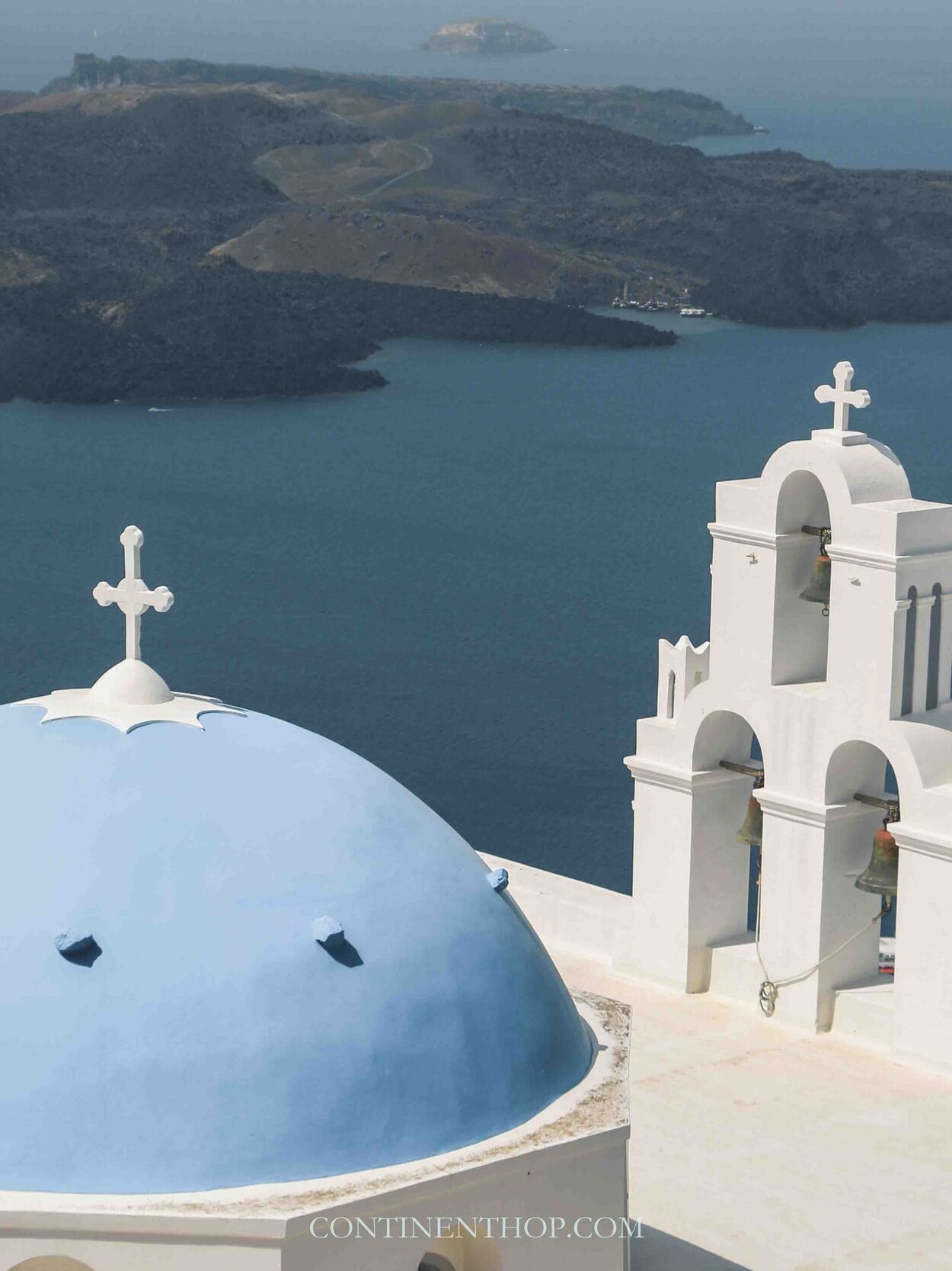 Blue domed churches in Santorini one of the best European countries to visit in June