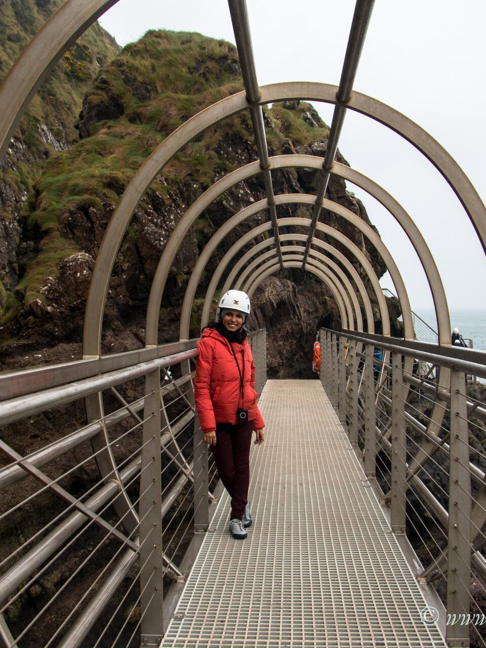 Woman standing on the gobbins tour tubular bridge