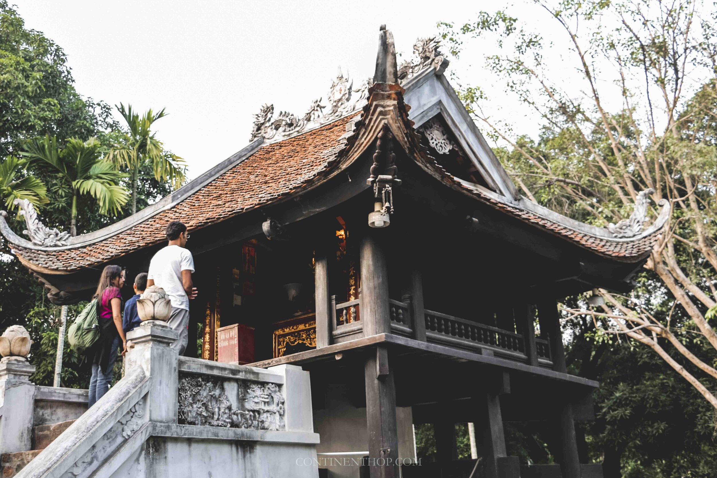 Image of people praying outside the one pillar pagoda in Hanoi Vietnam