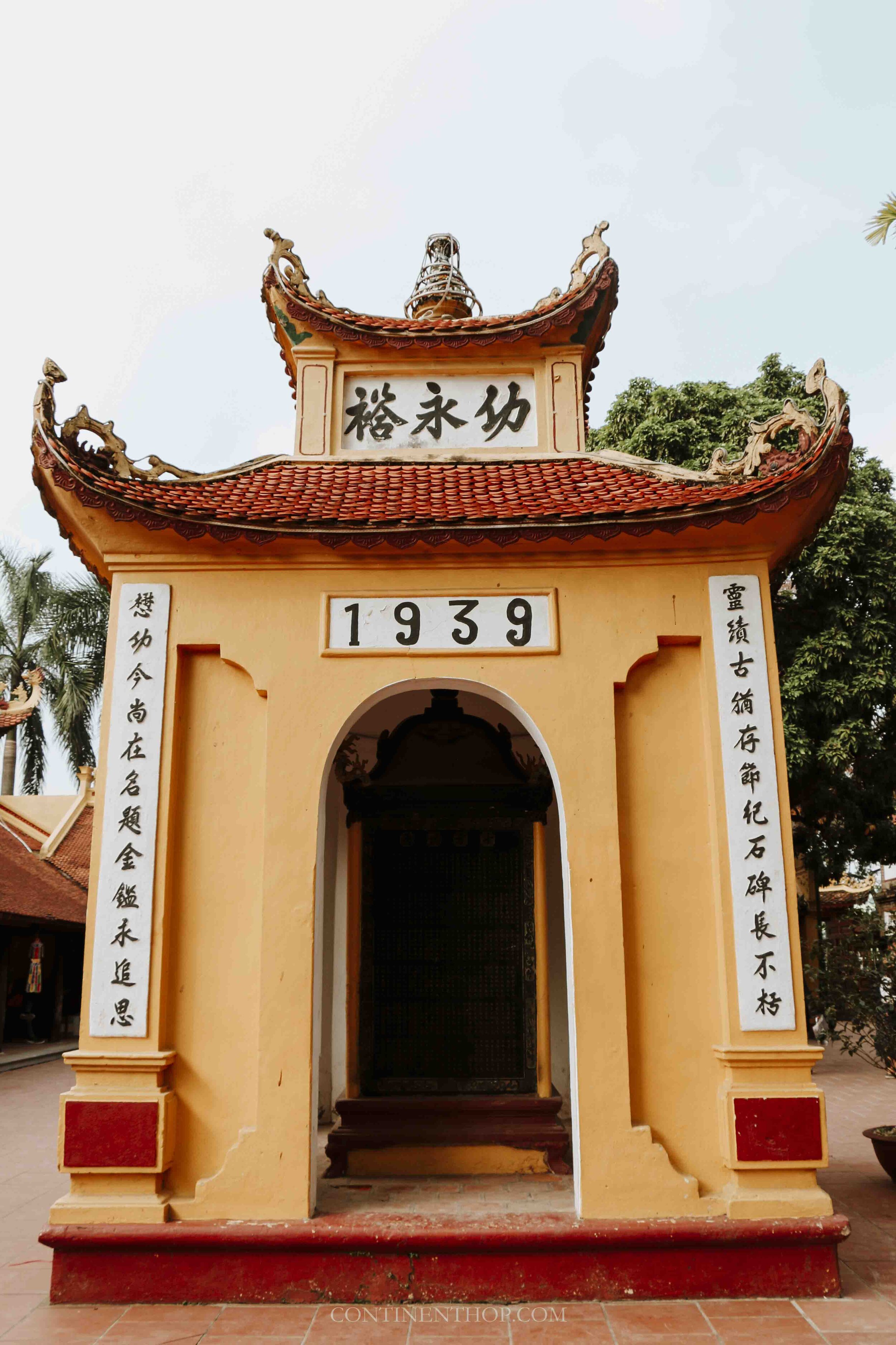 Image of a yellow archway to a pagoda in Hanoi Vietnam
