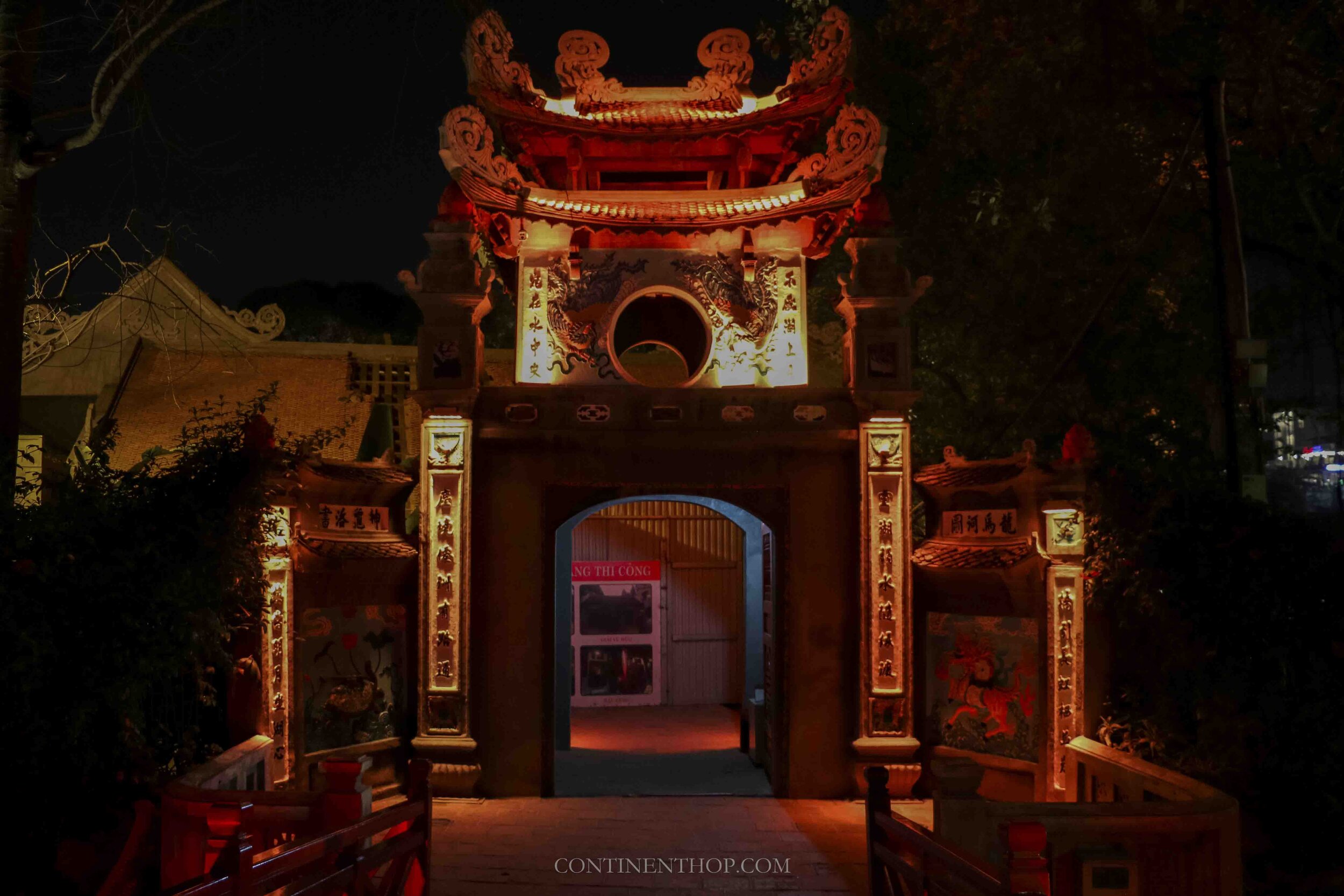 Image of Ngoc Son temple lit up at night in Hanoi Vietnam