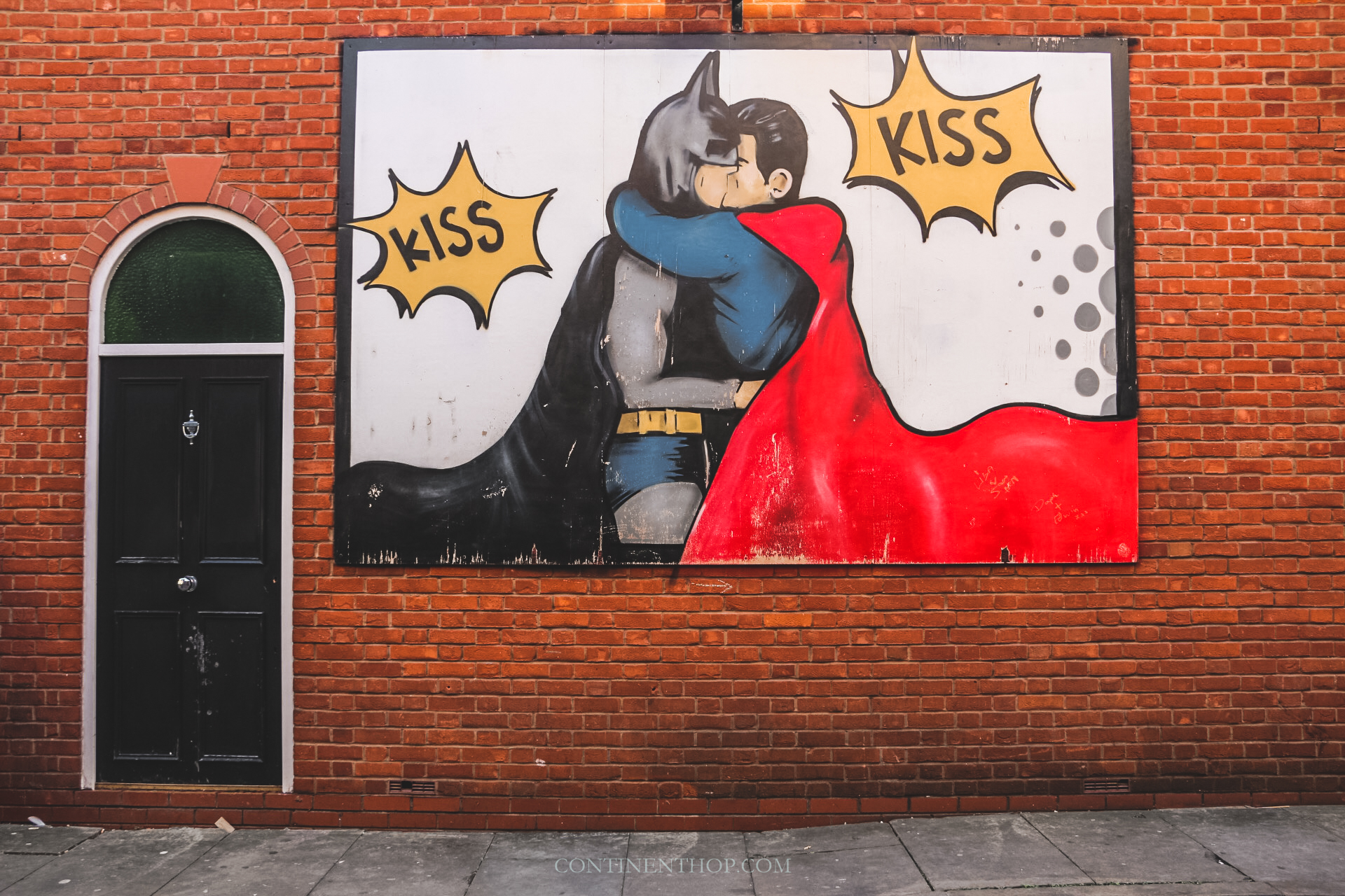 batman superman kiss street art manchester attractions travel guide