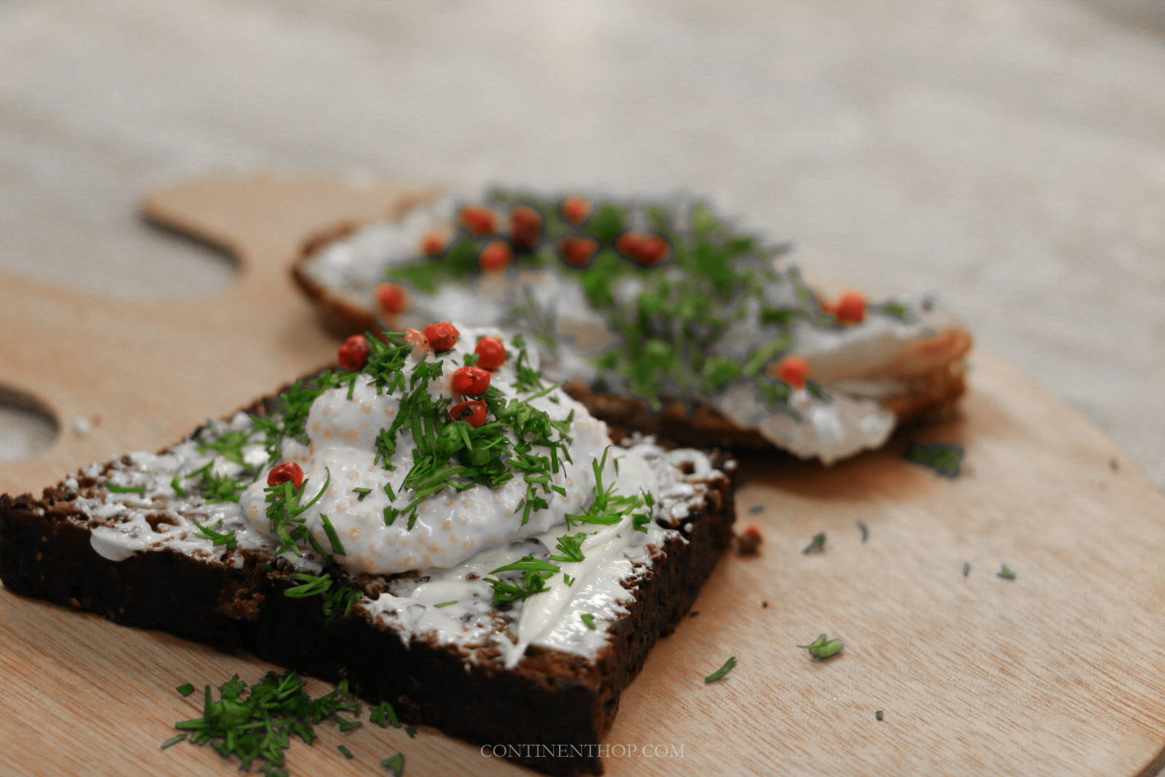 dark rye bread with sour cream and roe part of a typical traditional finnish food