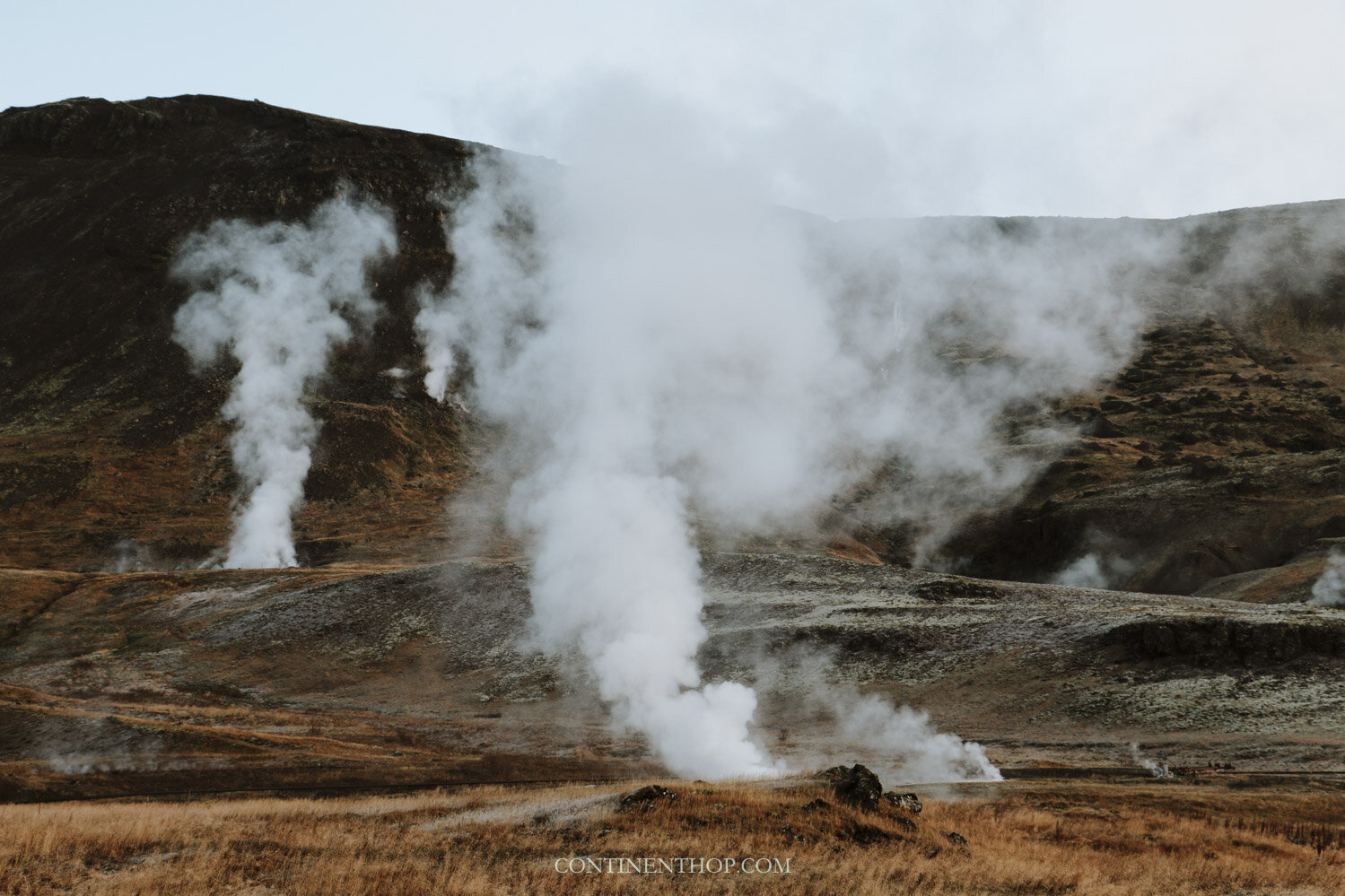 A fumarole field with steam escaping from gas vents as seen on an Iceland 6 day itinerary