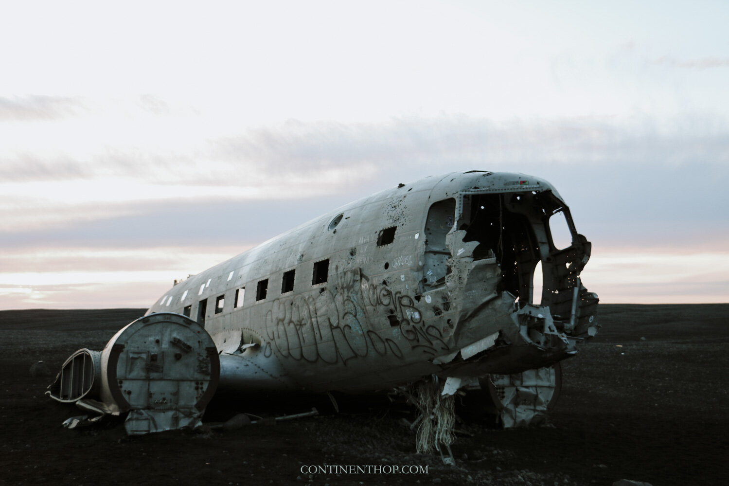 The Solheimasandur plane wreck on a black sand beach as seen on an Iceland 6 day itinerary