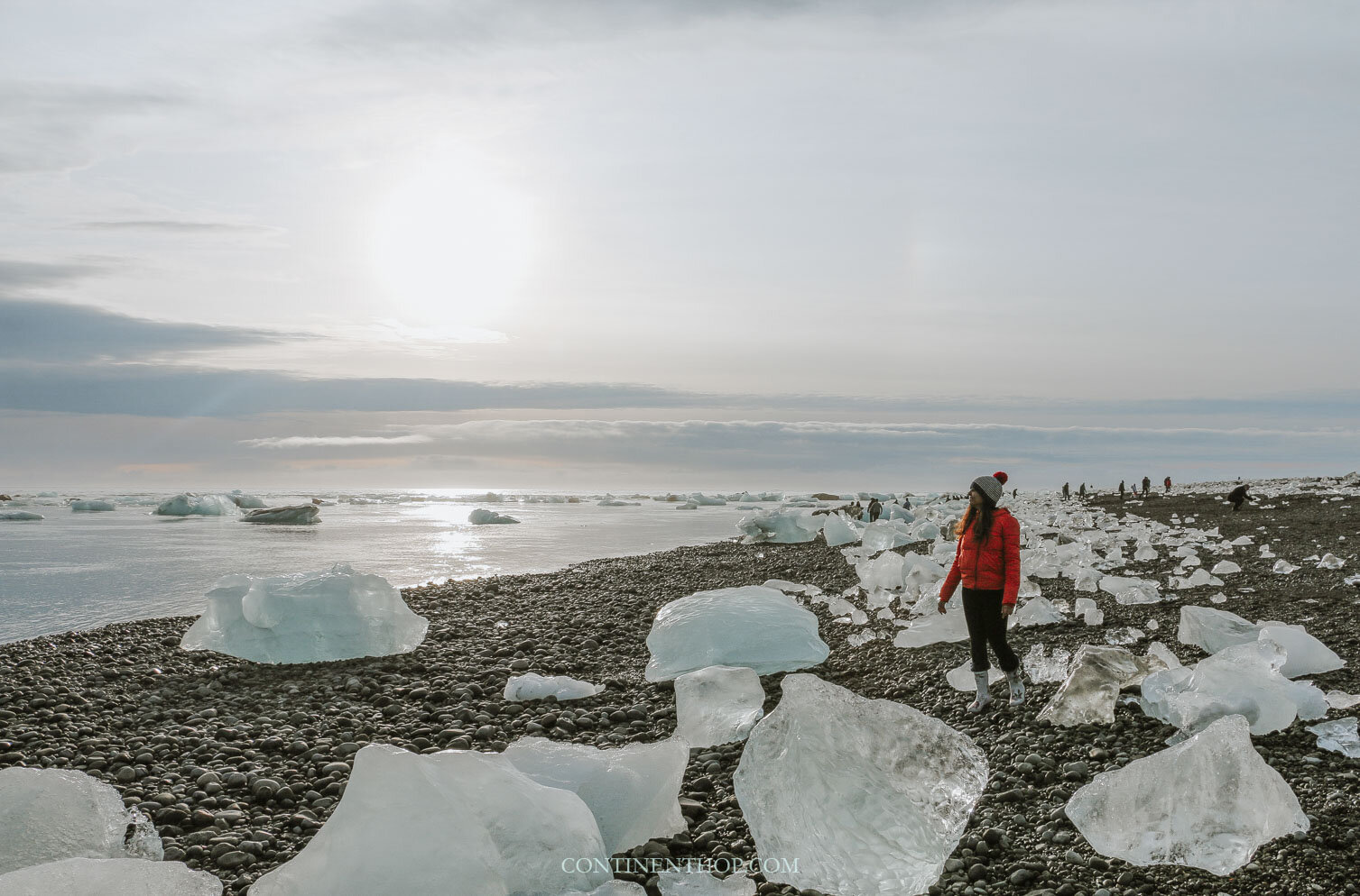 Woman walking on Diamond beach in Iceland
