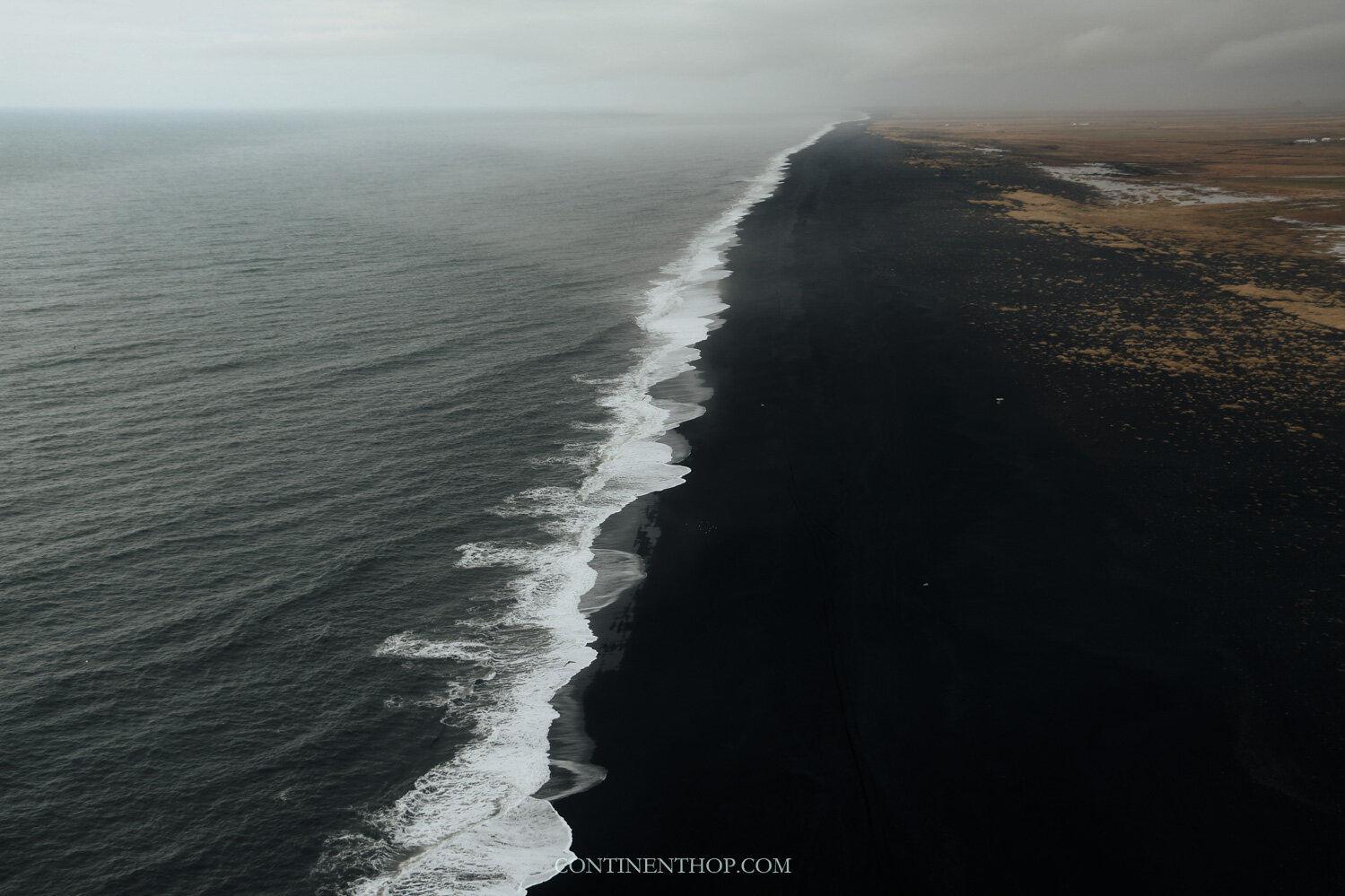 Waves crashing on the shore of a black sand beach as seen on a 6 day Iceland Itinerary