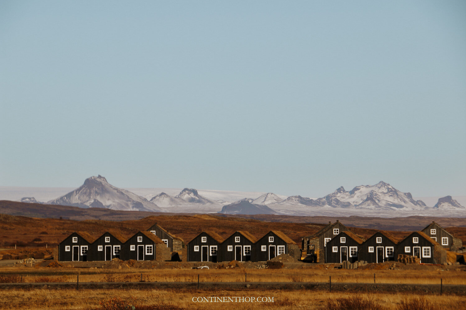 Houses in front of a mountain range seen on an Iceland 6 day itinerary