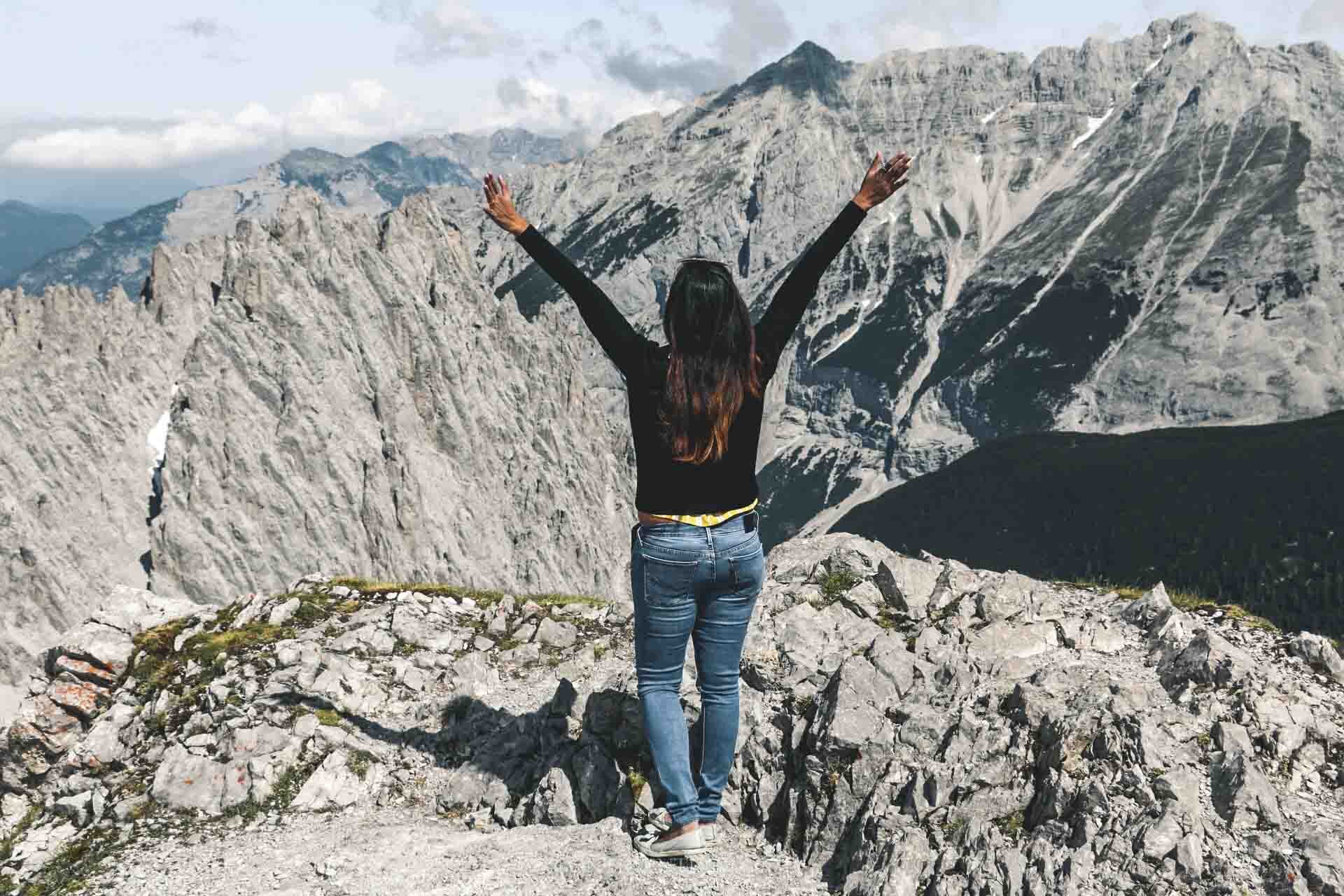 woman standing at the top of the Nordkette mountains in Innsbruck