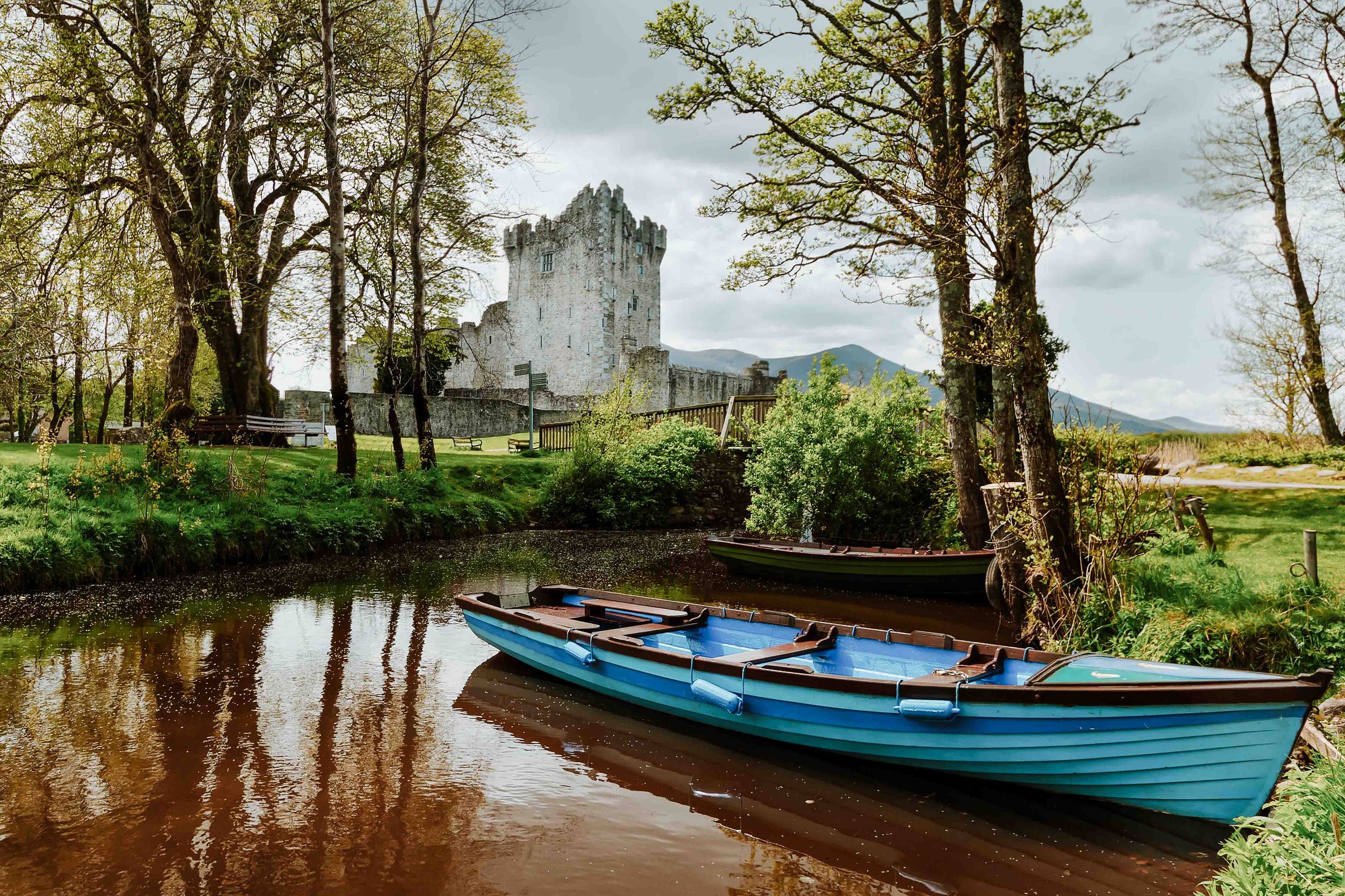 blue boat by ross castle in ireland in spring in ireland