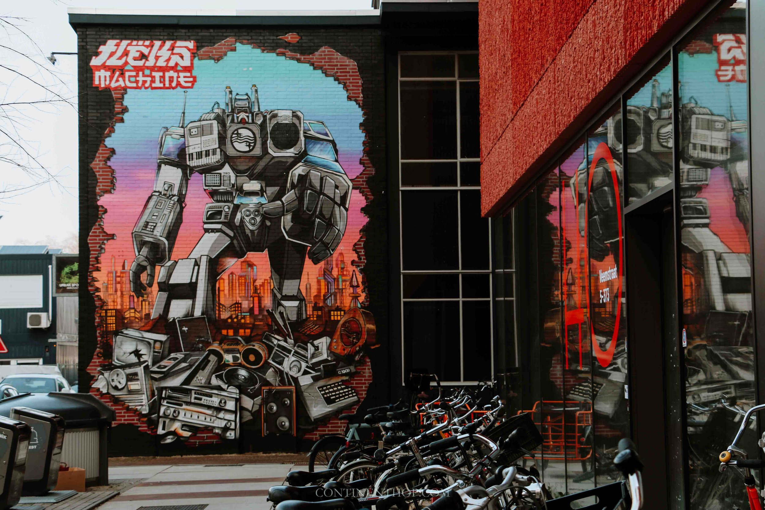 A colourful mural of a robot on a street in Eindhoven is Eindhoven worth visiting