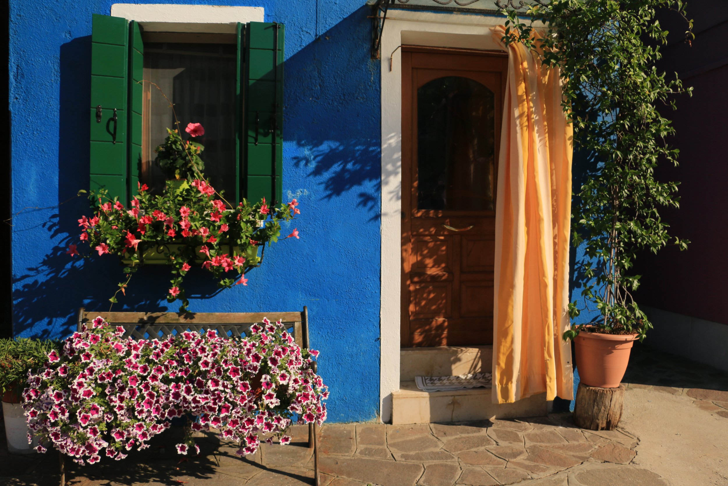summer italy in july colorful bright blue house