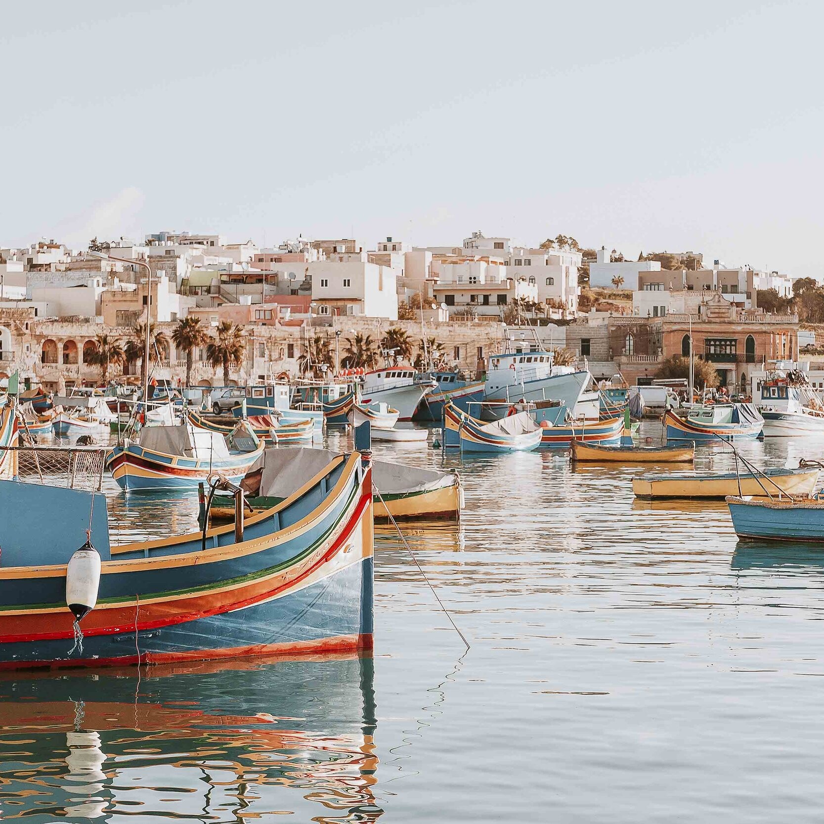 Marsaxlokk fishing harbour with colourful fishing boats on a Malta weekend break on a 2 days in Malta itinerary