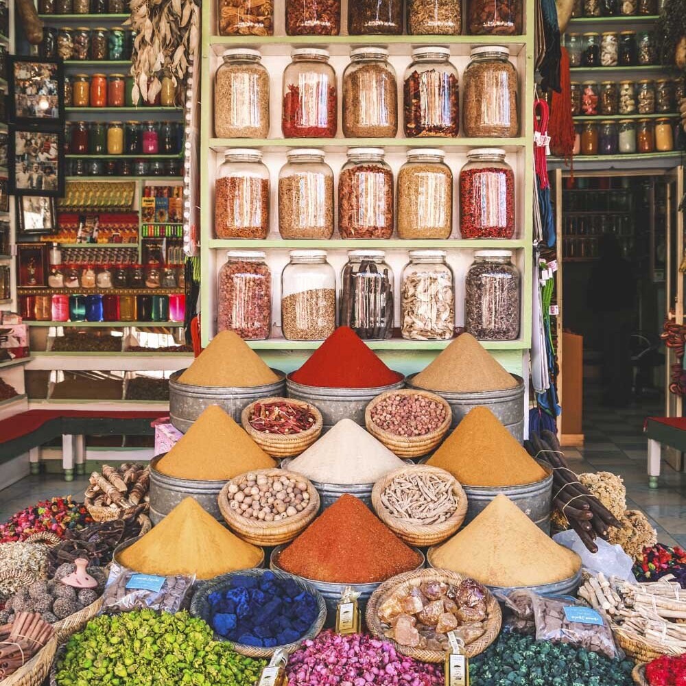 A colorful rack of spices in the souks of Marrakech in Morocco