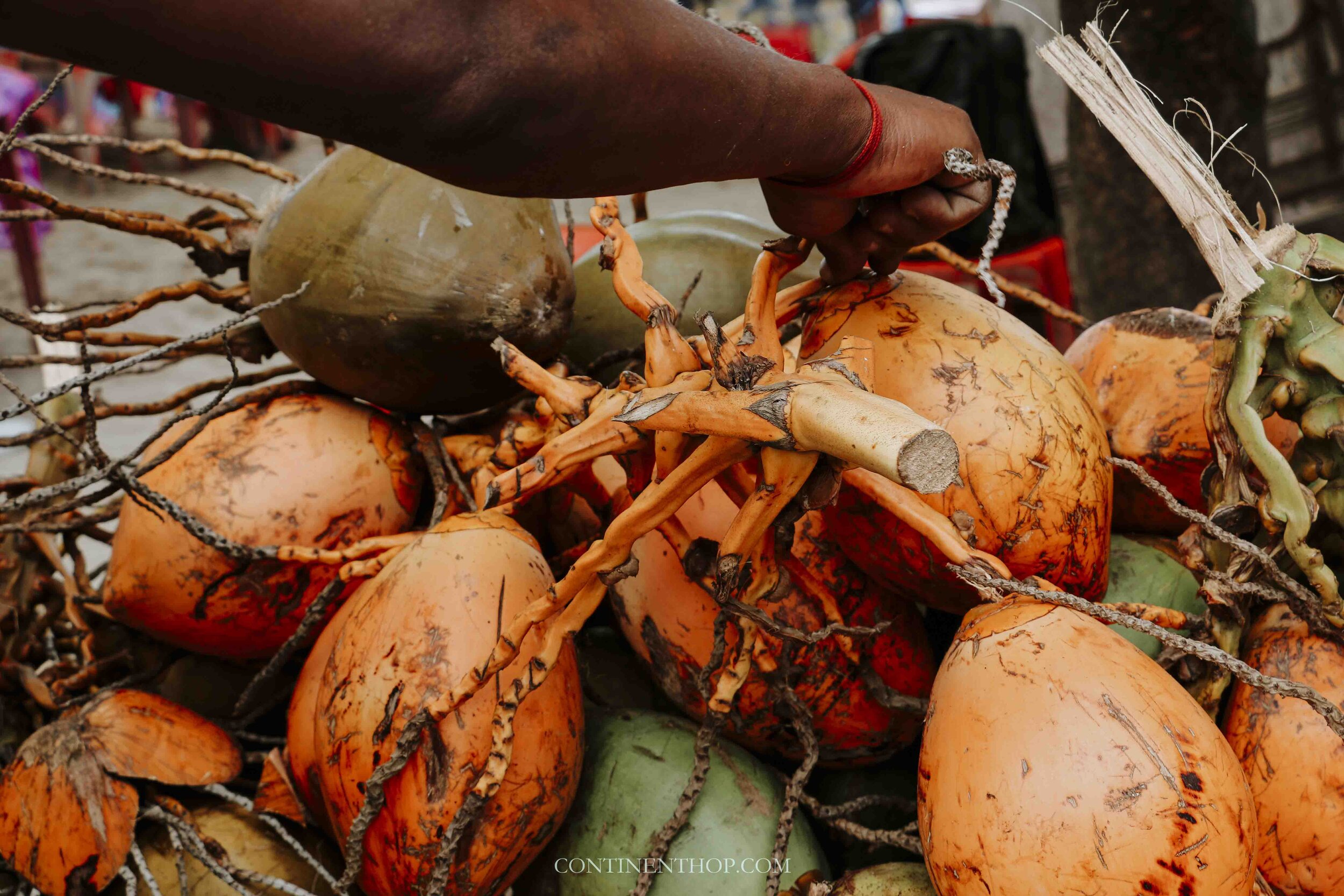 coconuts being sold at a Mauritian street food stall