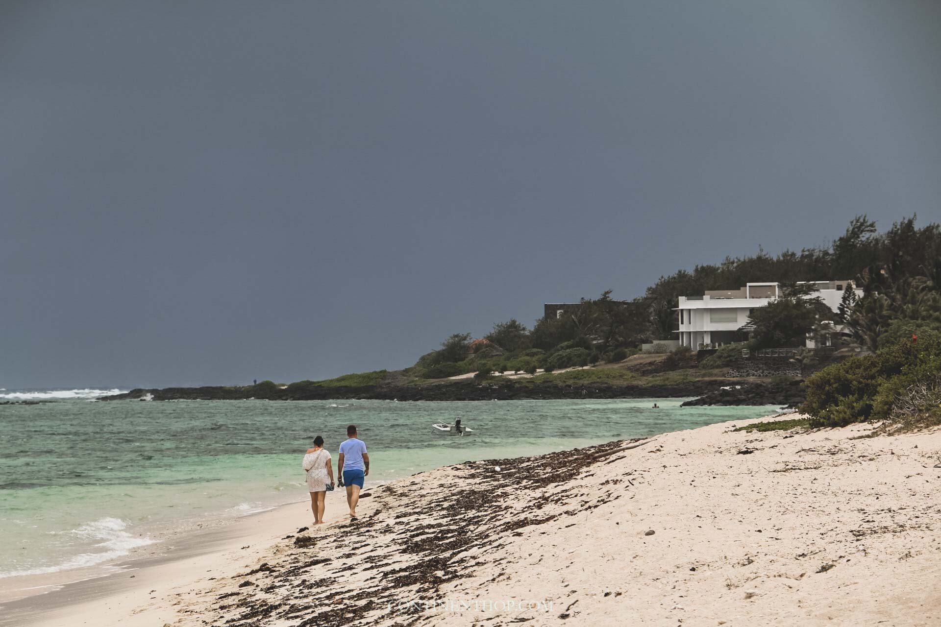 Couple walking on the beach in Mauritius