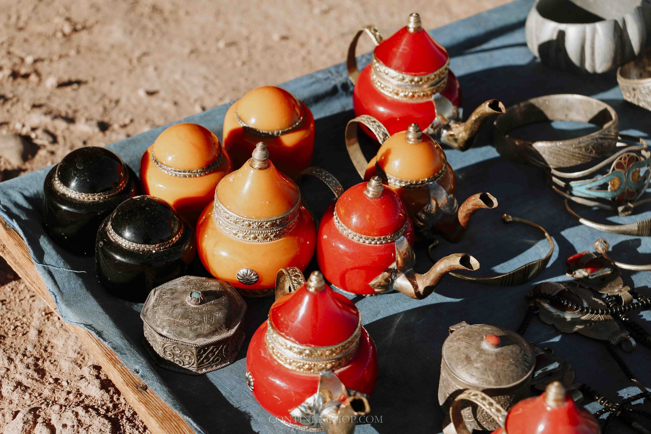 Colorful teapots on a blue mat in December in Morocco in winter