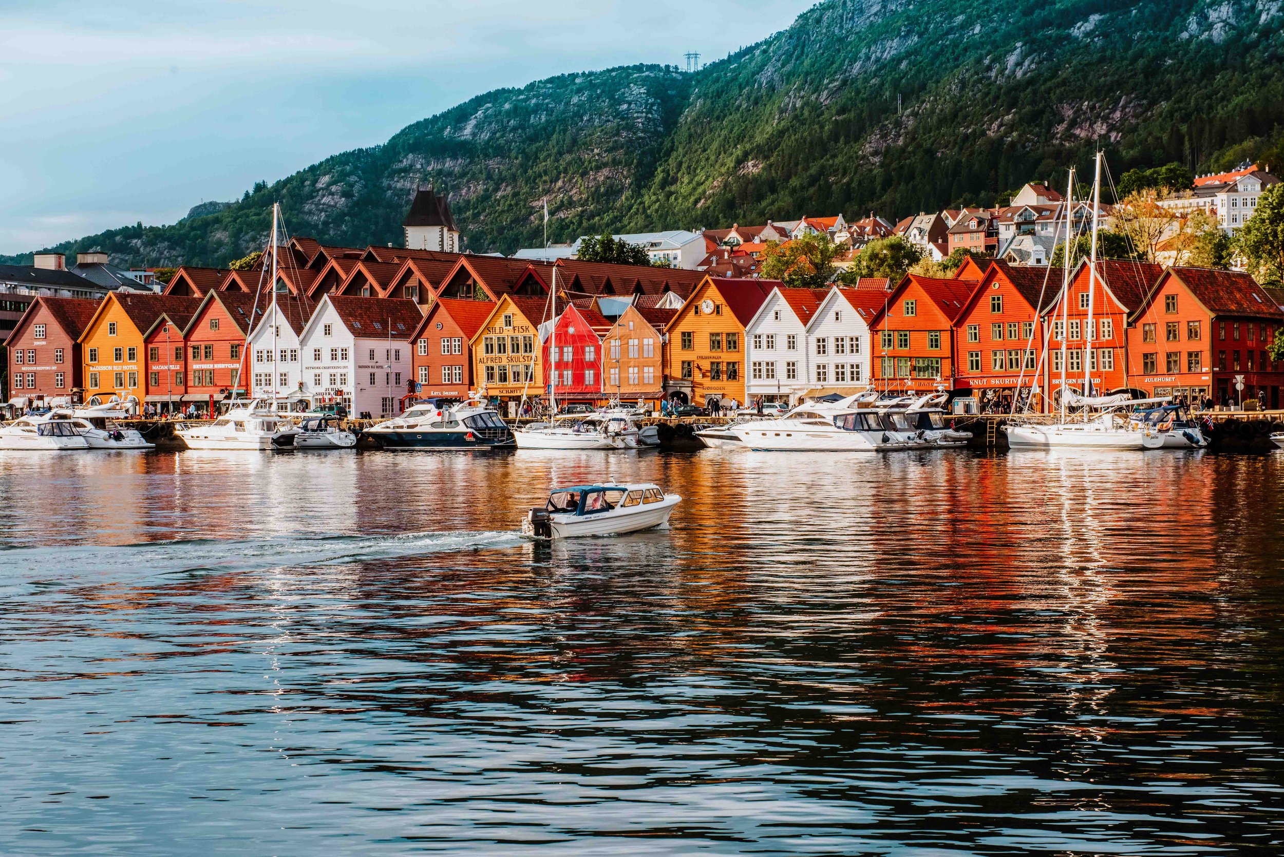 Colourful houses with boats in front in Bergen on a Scandinavia itinerary 10 days