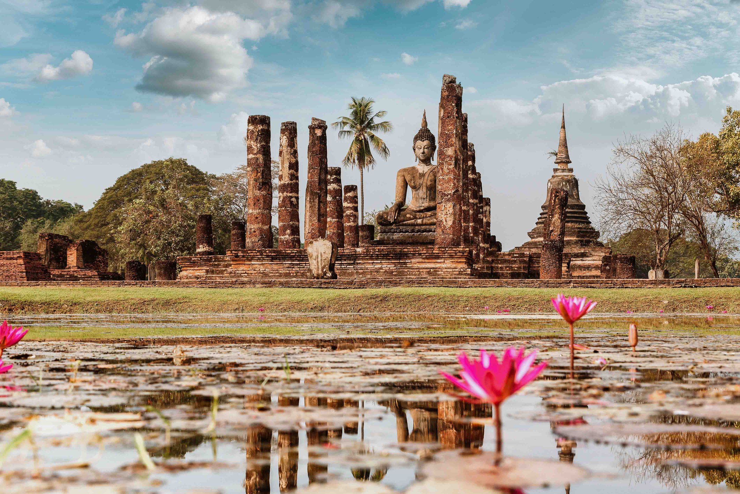 Sukhothai national park temple with lotuses in pond on Thailand 1 month itinerary