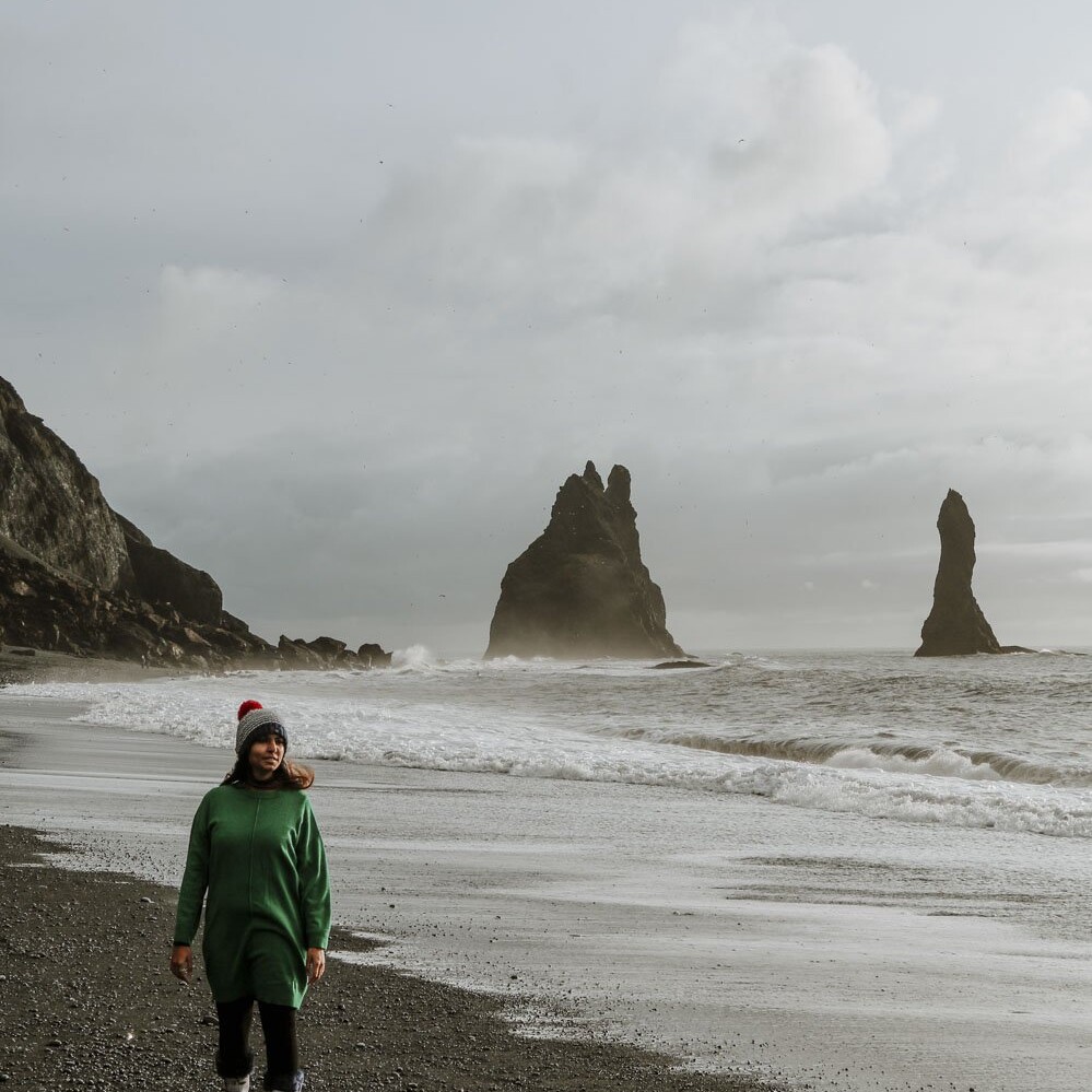 Woman walking on beach in Iceland in August