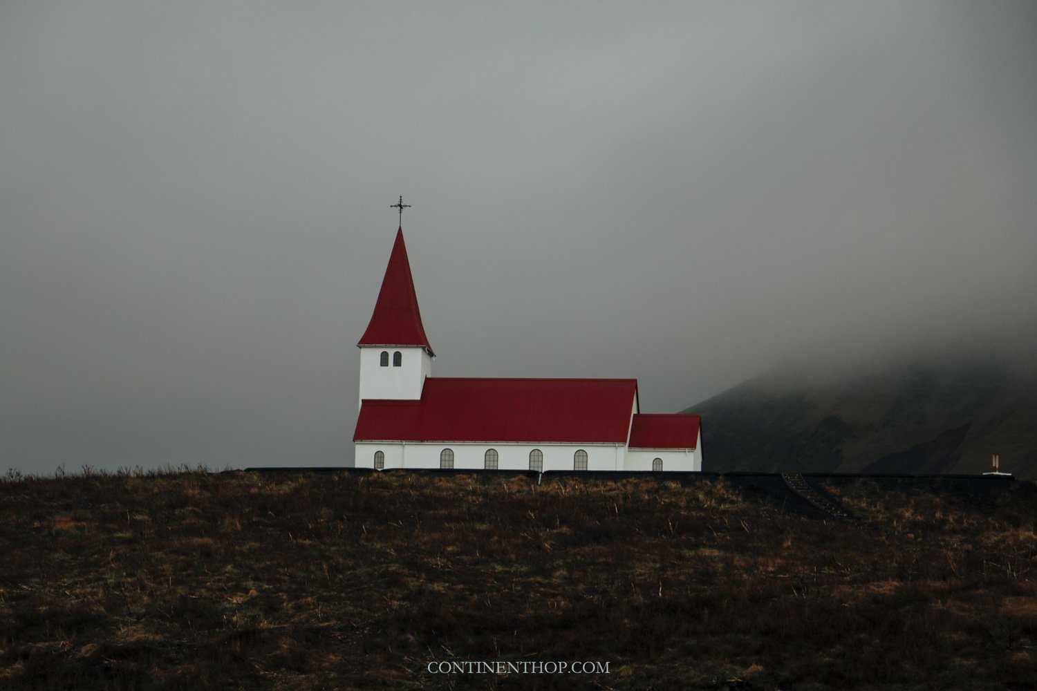 Red and white house in Iceland in August