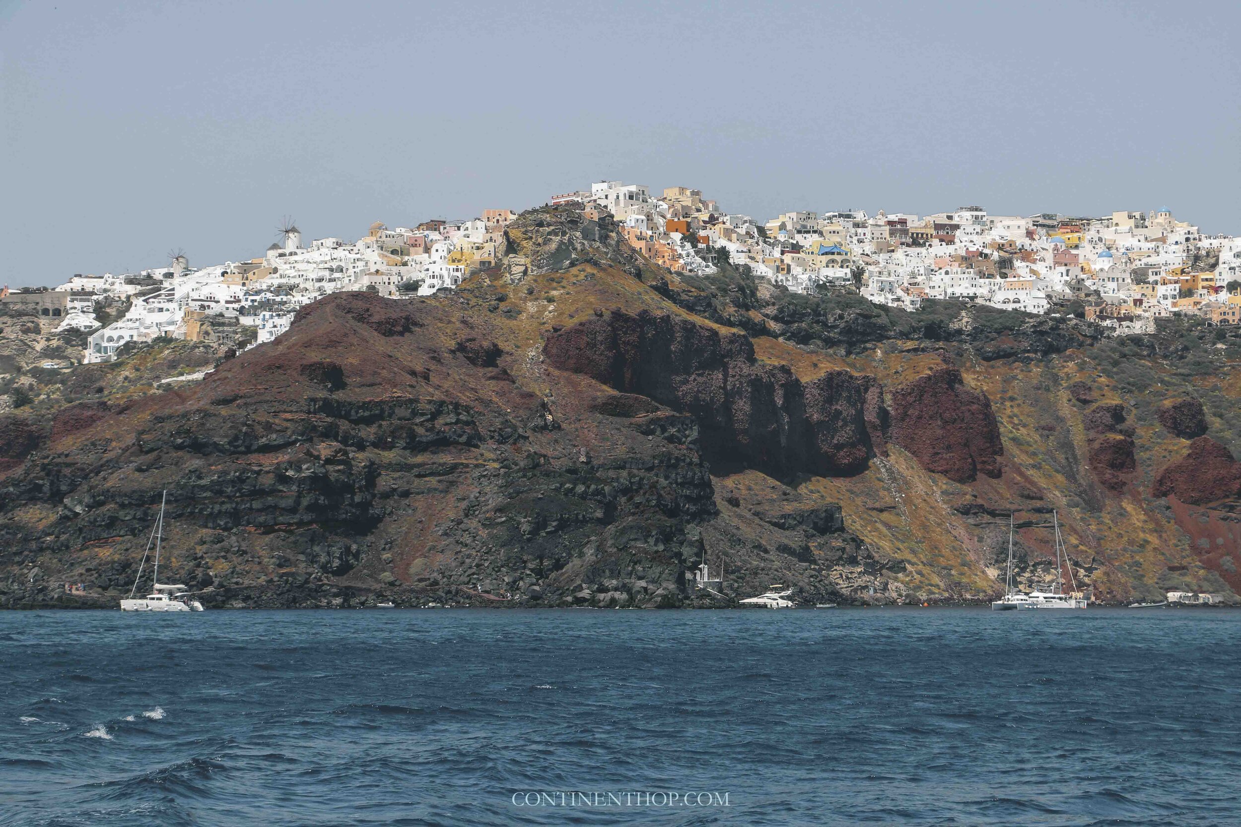 Ammoudi Bay in Oia Santorini with houses on top