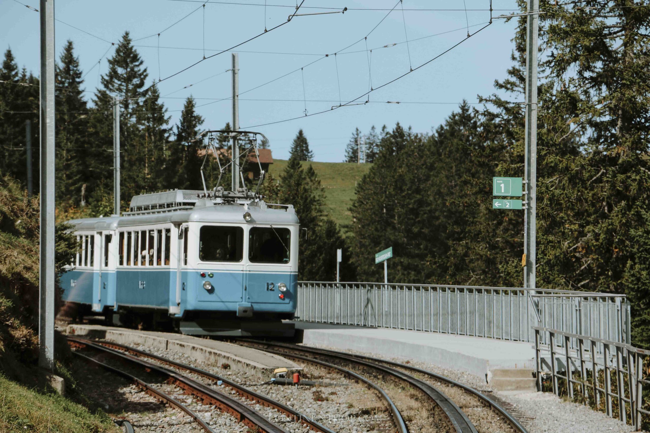 A blue train to rigi in autumn in Switzerland in fall
